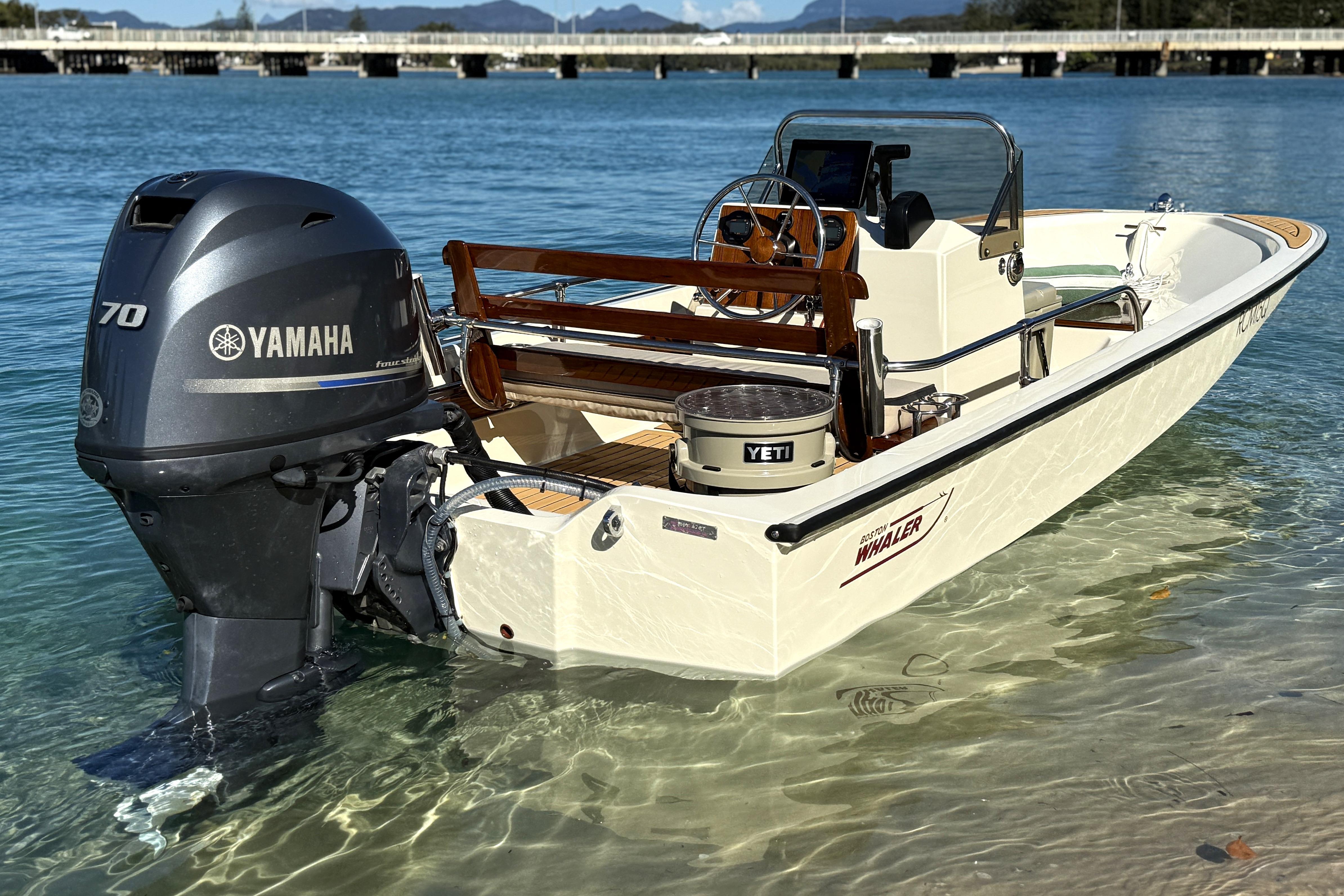 1987 Boston Whaler 150 Super Sport with Yamaha engine in clear blue water.