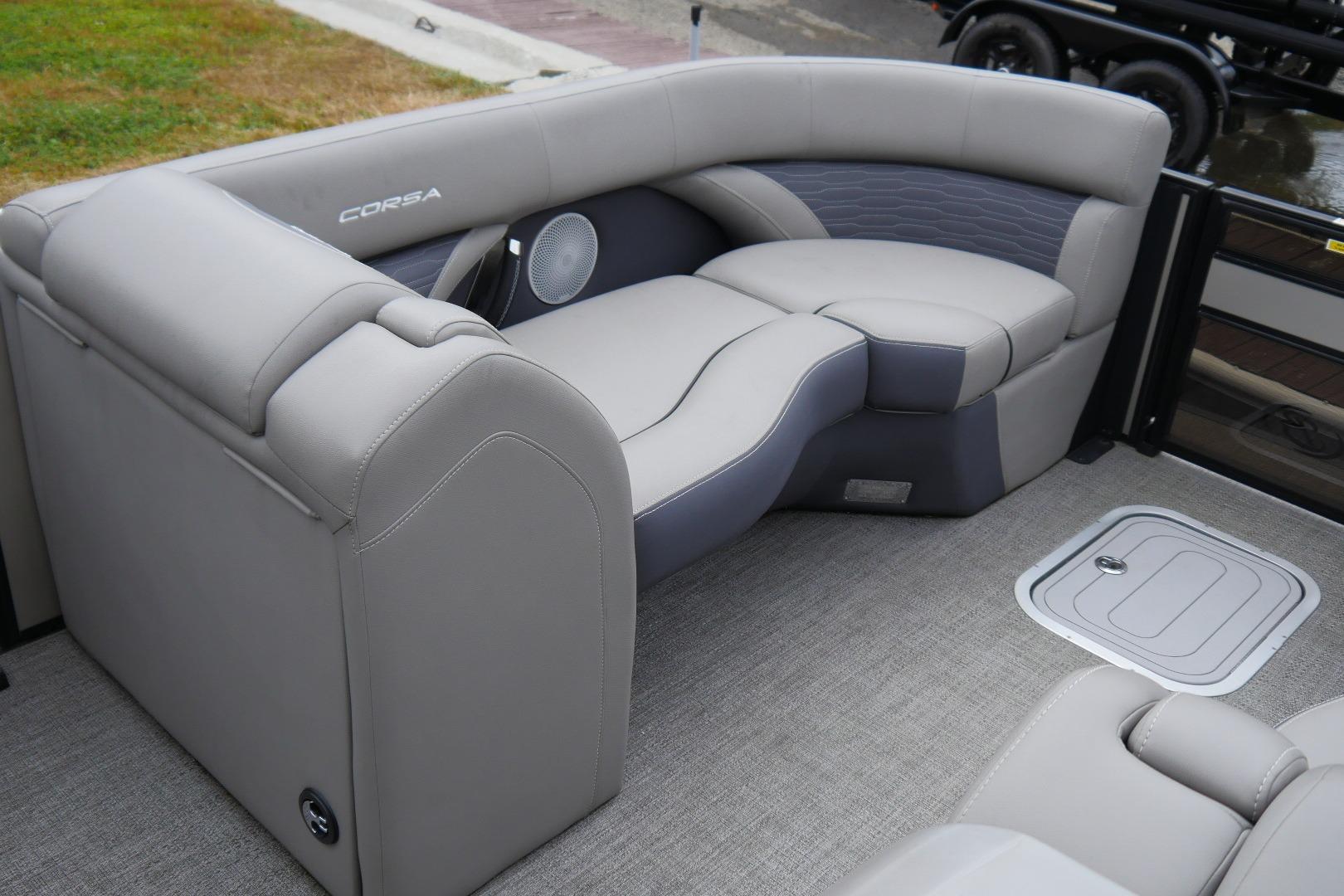 Luxurious seating area on 2023 Barletta CORSA 25UE pontoon boat, featuring elegant upholstery.
