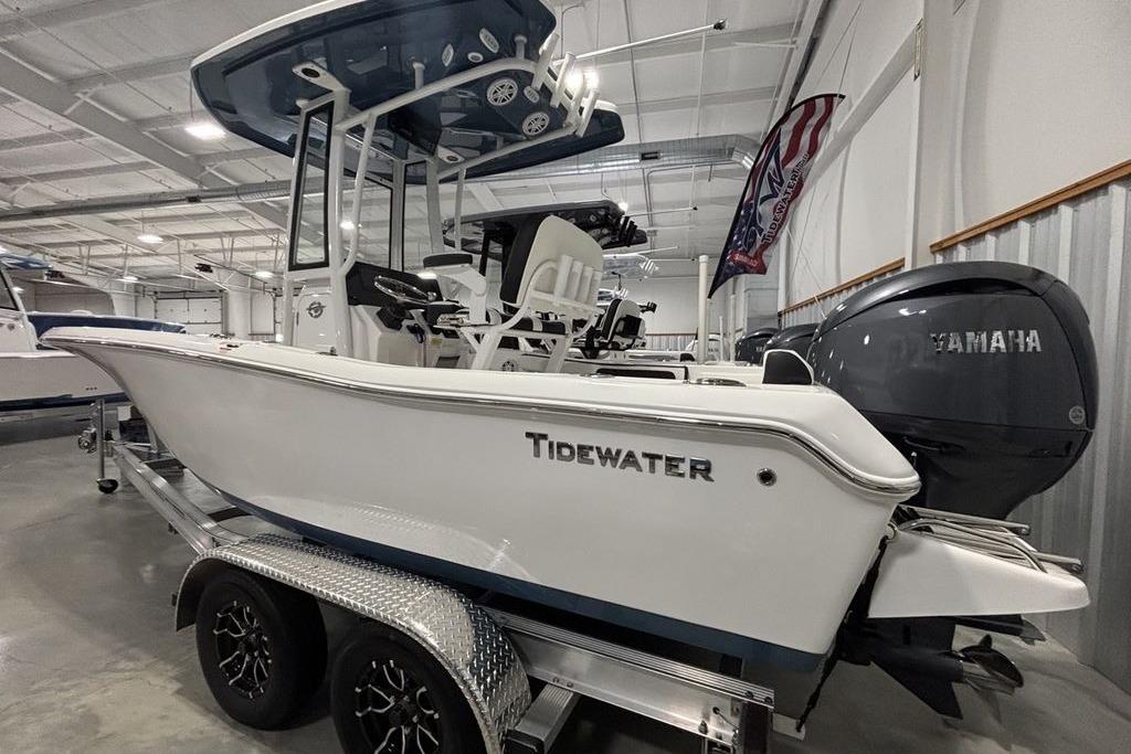 2026 Tidewater 198 CC Adventure boat on trailer in showroom.