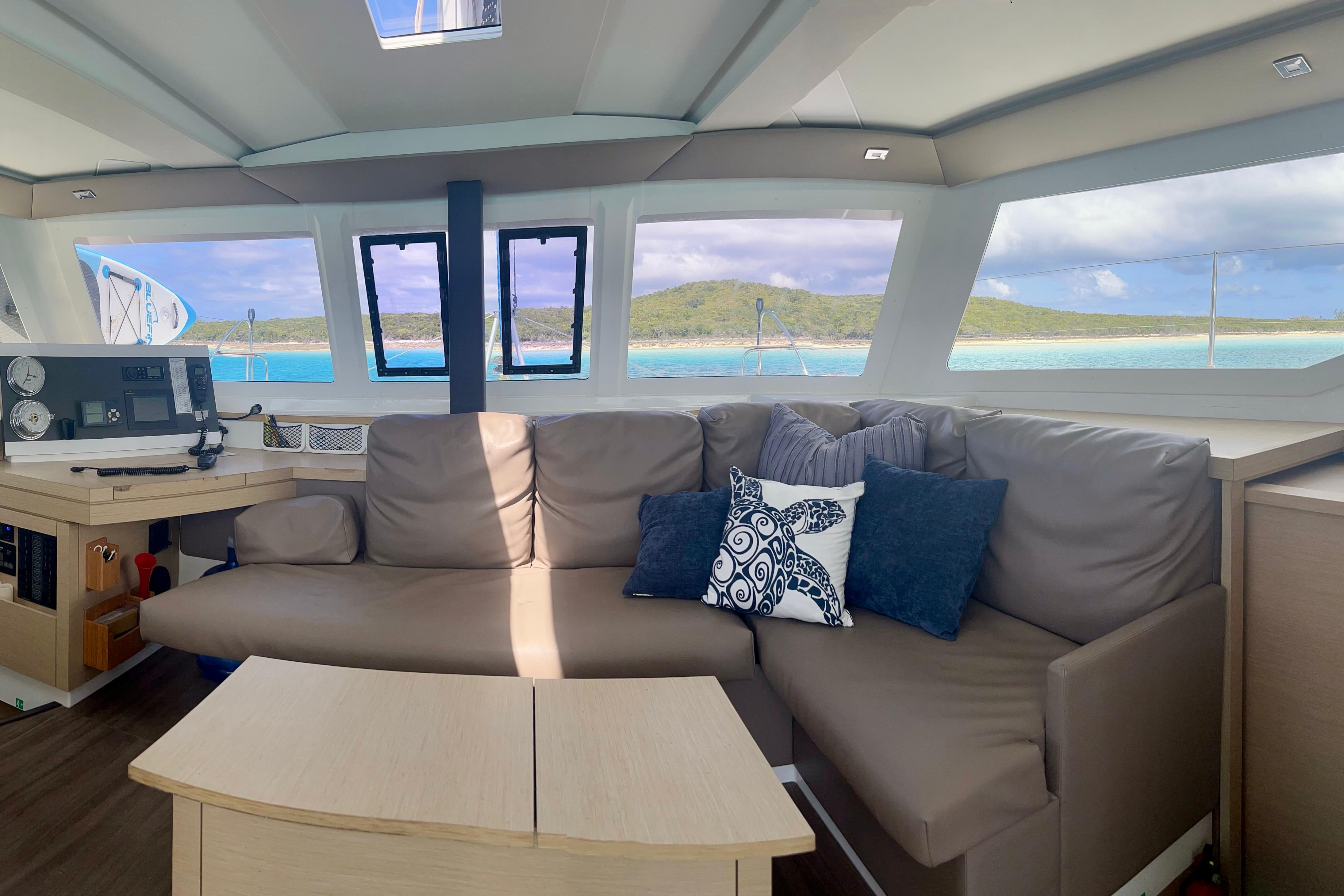 Interior of 2018 Fountaine Pajot Lucia 40 catamaran with ocean view through windows.