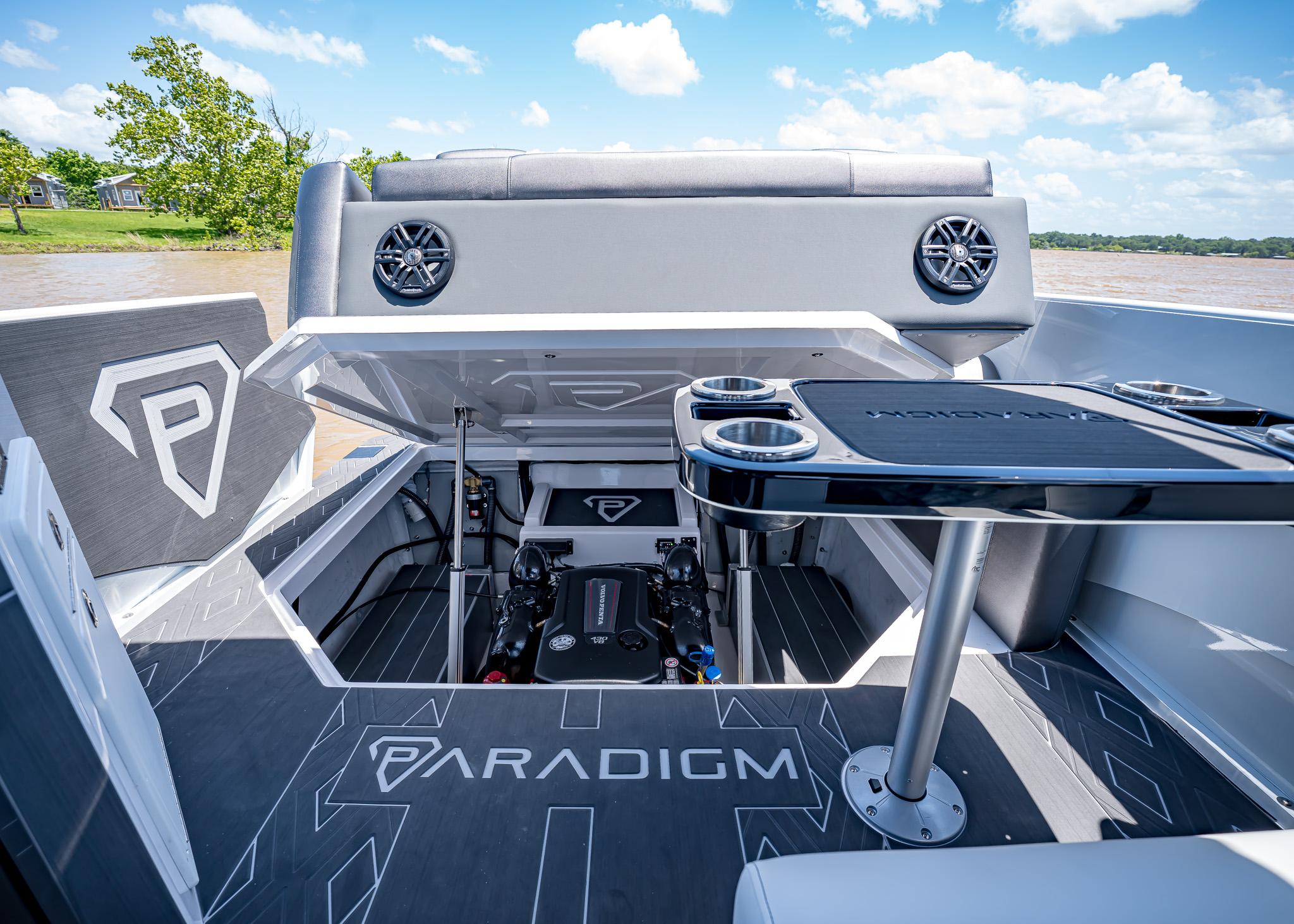 2025 Paradigm Damascus 266 Surf boat interior with open engine compartment and sleek design.