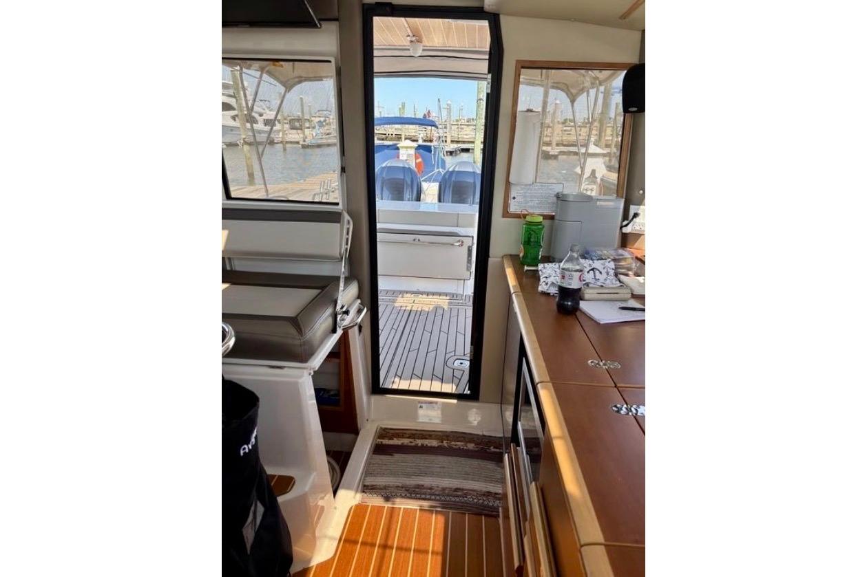 Interior view of 2024 Cutwater C-32 Coupe, showcasing cabin and deck area.