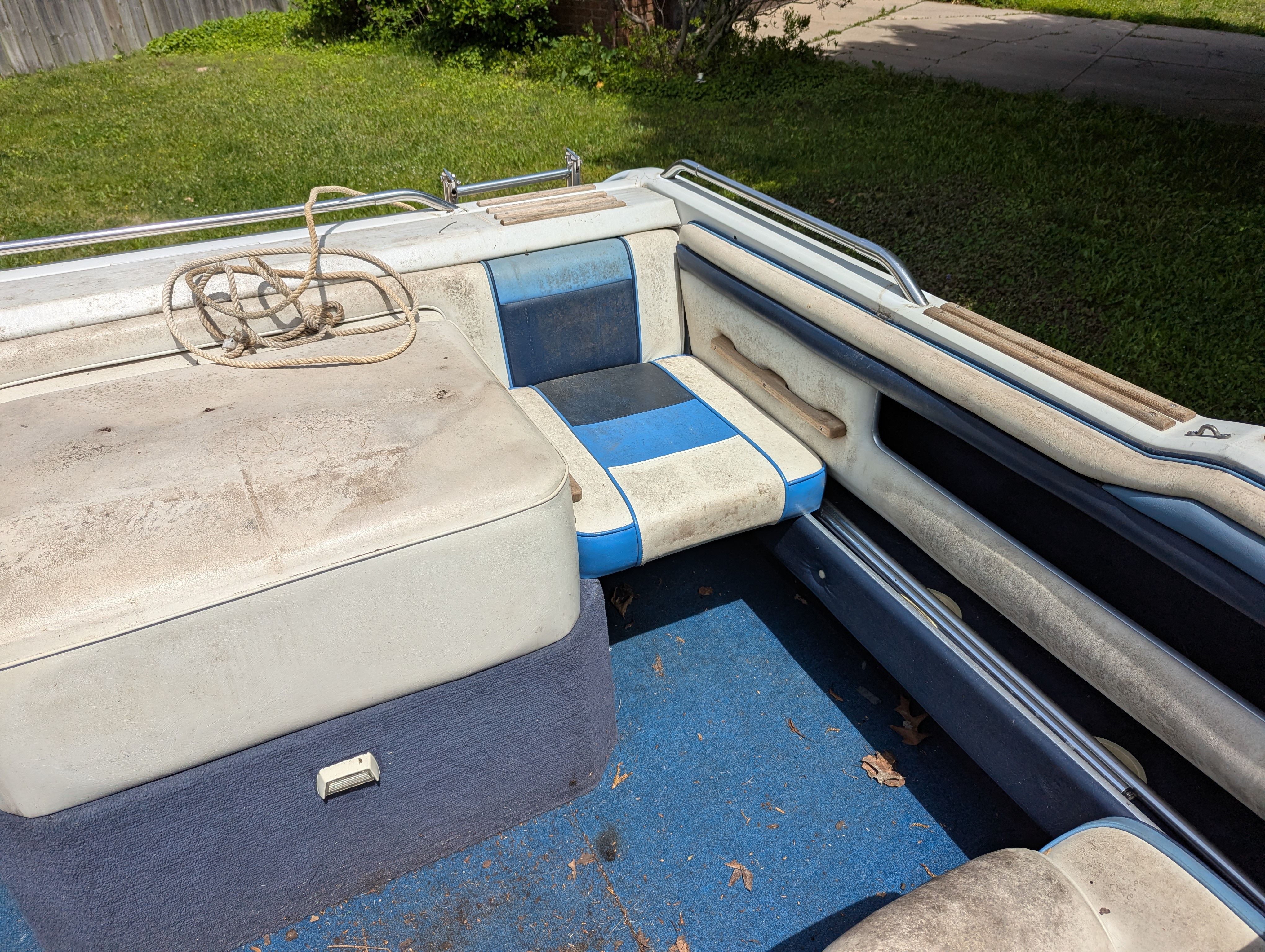 Interior of a 1988 Four Winns 200 Horizon boat with blue seats.