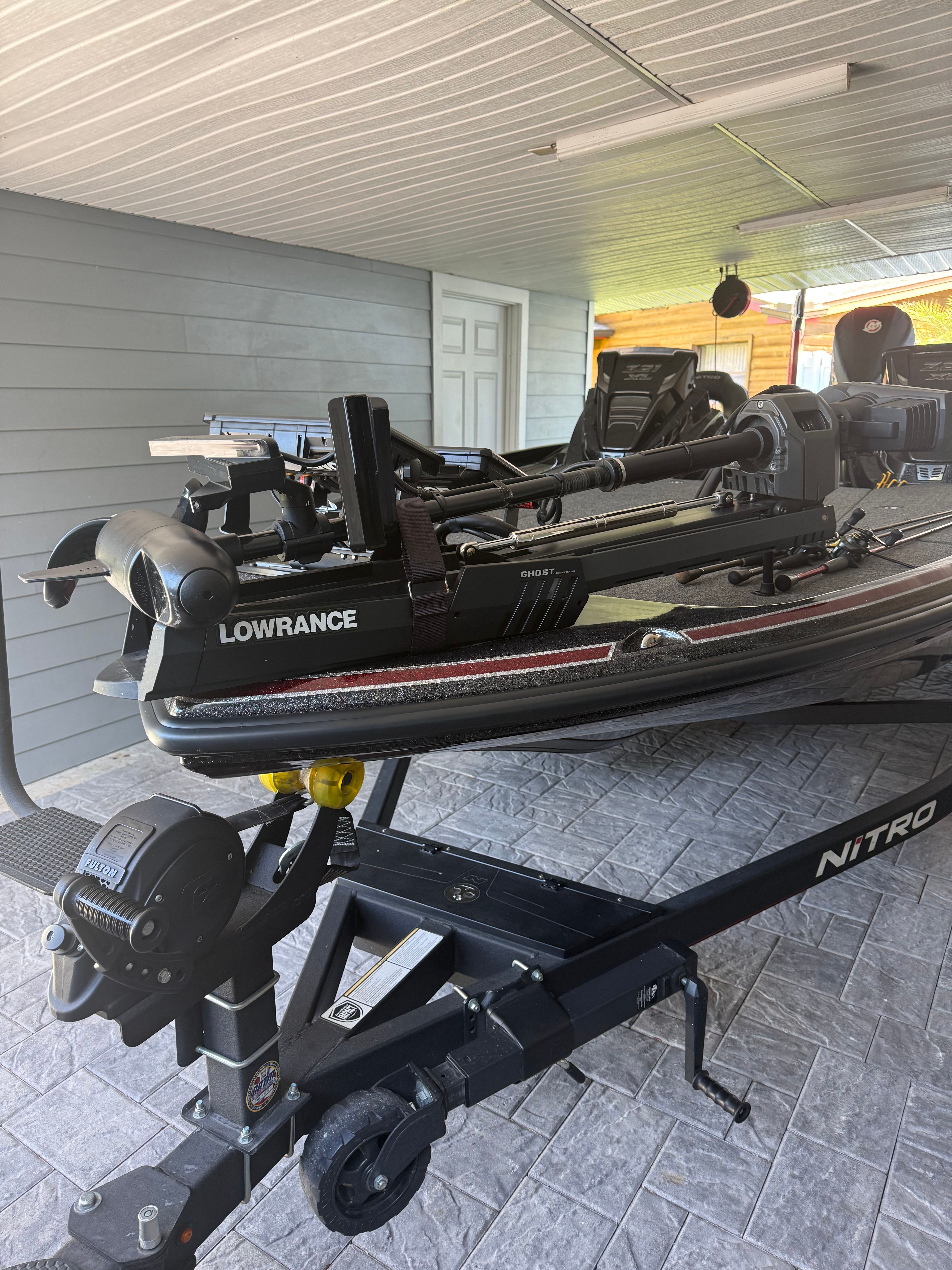 A 2024 Nitra Boats 21 XL Pro on a trailer, featuring Lowrance equipment.