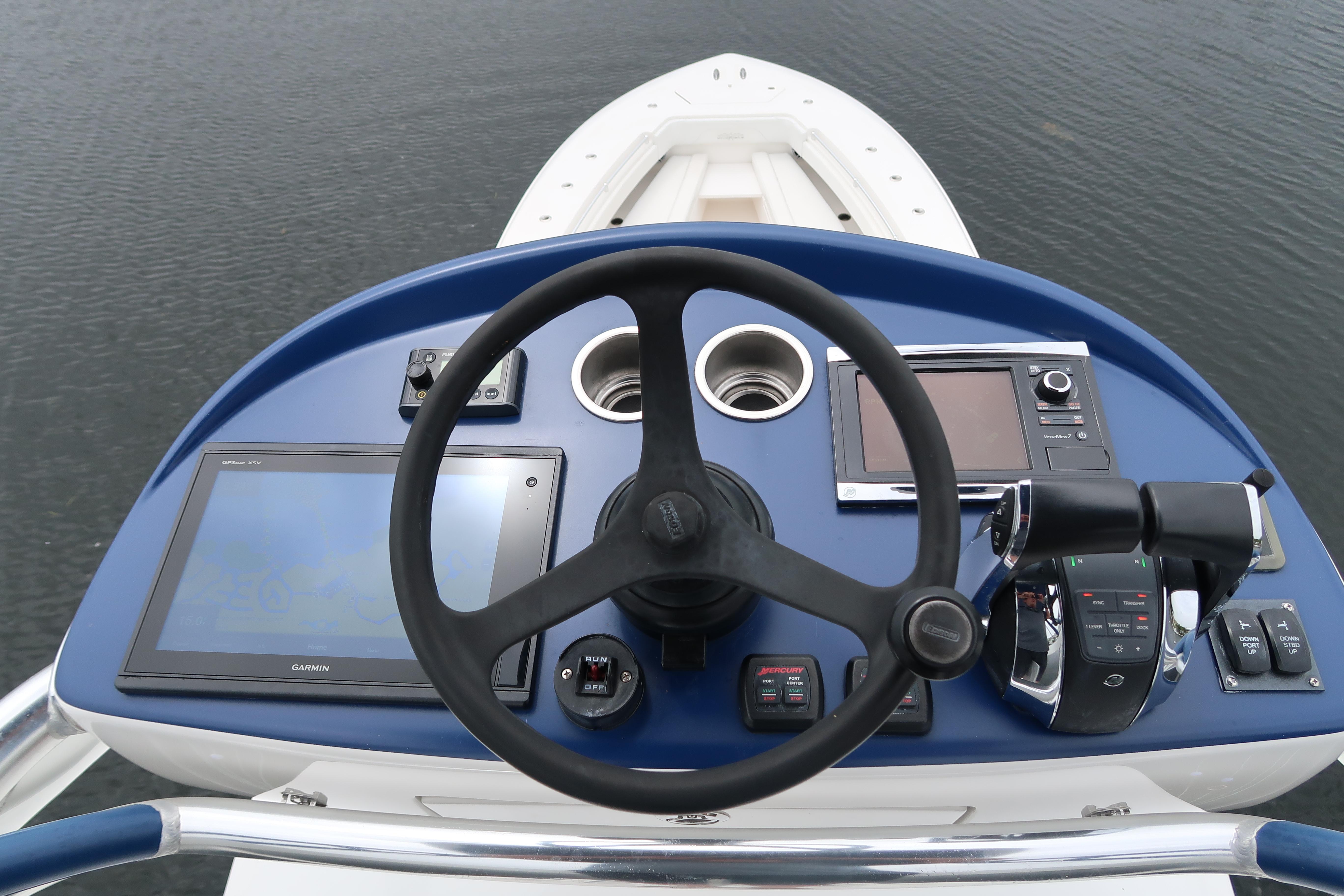 Helm of 2016 Invincible 42 Open Fisherman with navigation and control systems.