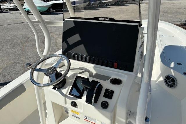 2026 Mako 24 APEX boat console with steering wheel and control panel.