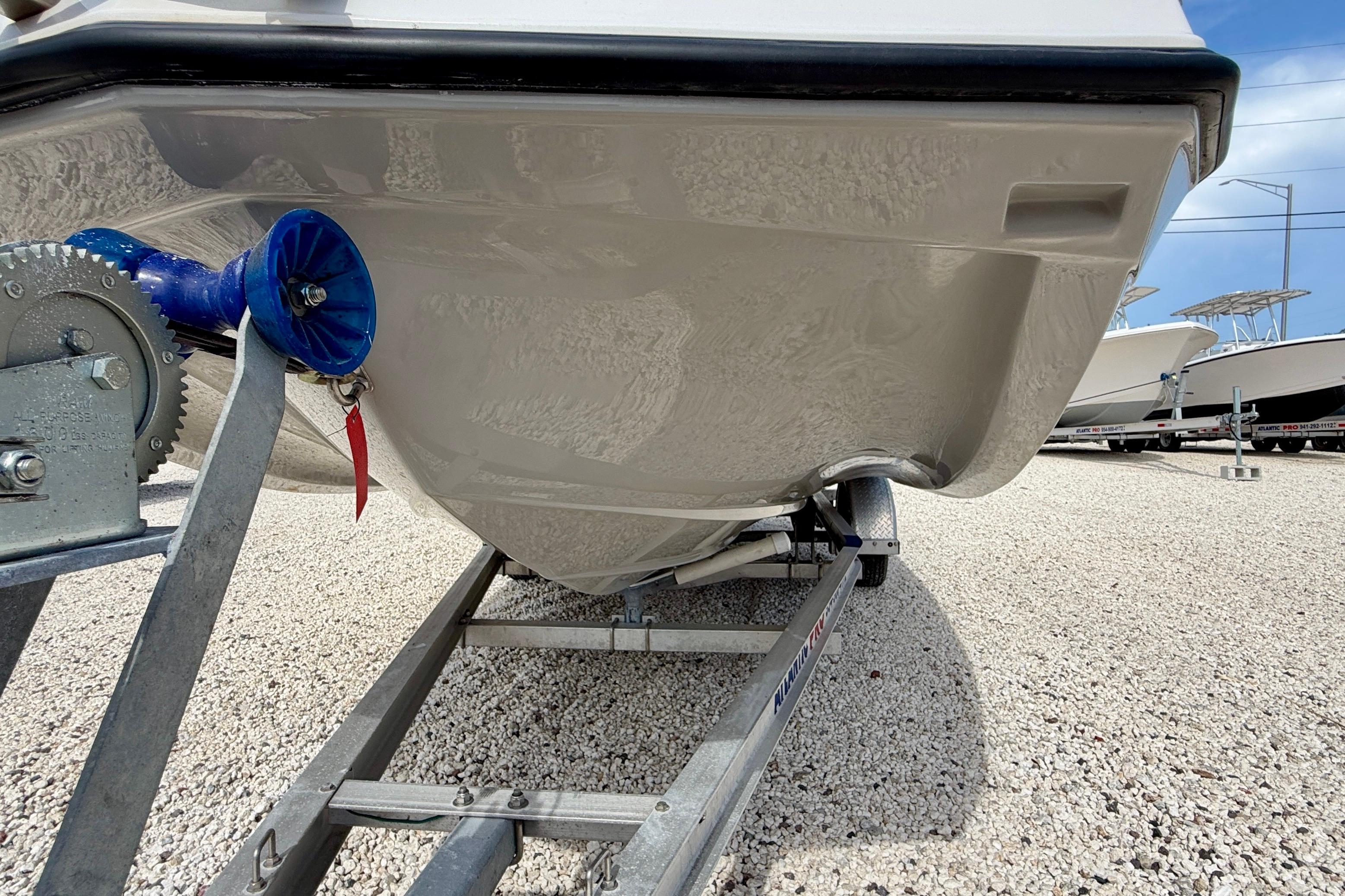 2021 Starcraft SVX 191 OB boat on trailer, close-up view of hull and winch.