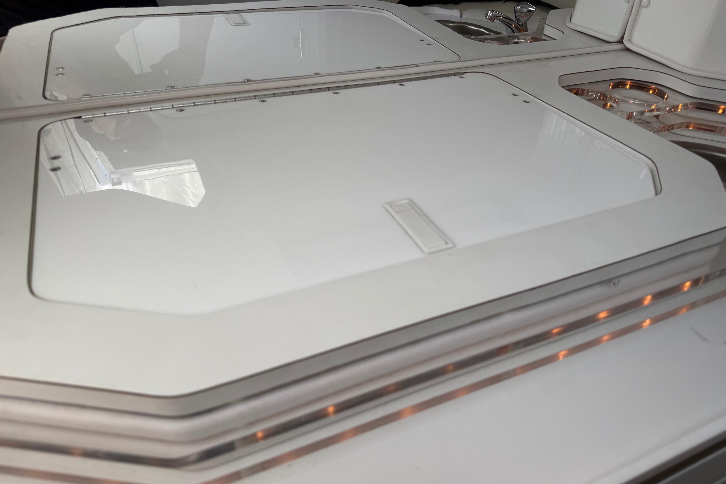 1998 Fountain 35 Lightning boat deck with sleek white finish and modern design elements.