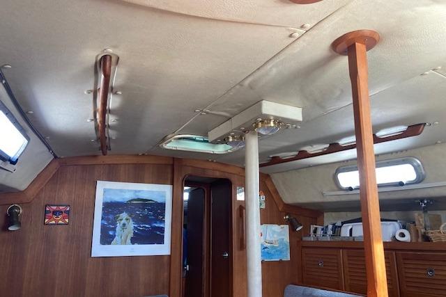 Interior of 1988 Westerly Corsair 36 sailboat with wooden accents and nautical decor.