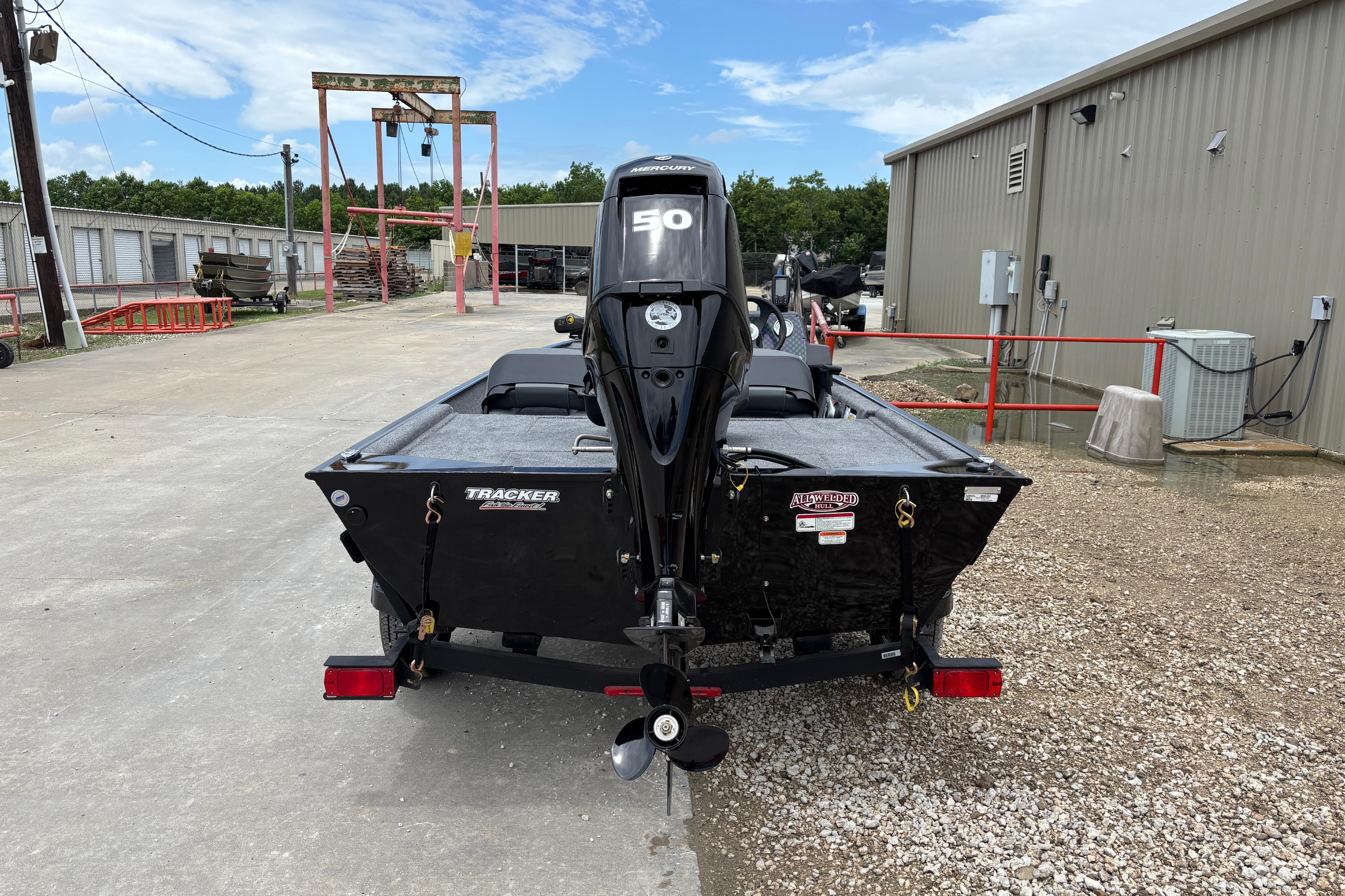 2026 Tracker Bass Tracker Classic XL boat with 50 HP motor, parked outdoors.