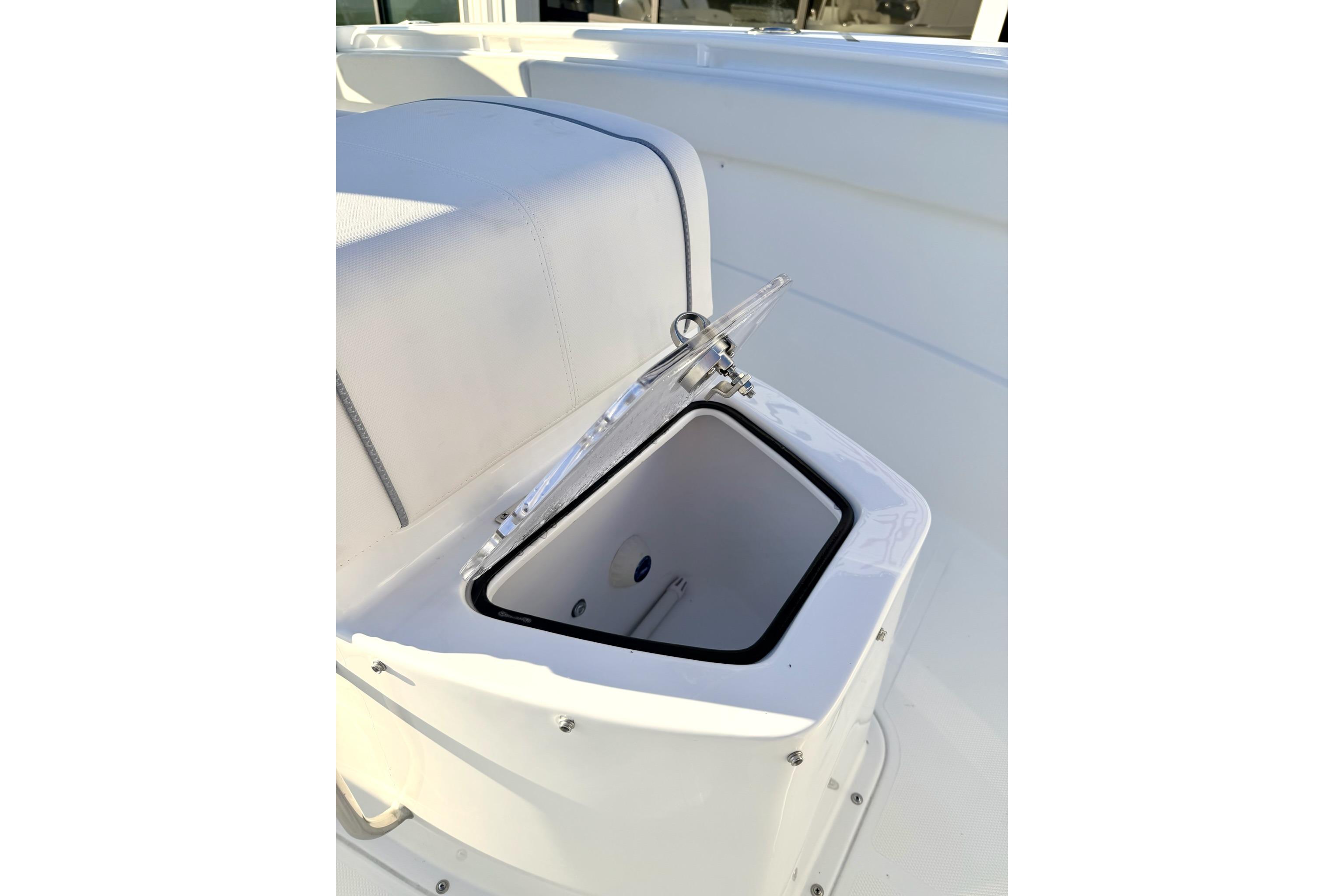 2026 Sea Hunt Ultra 275 Coffin Box open, showcasing interior storage space.