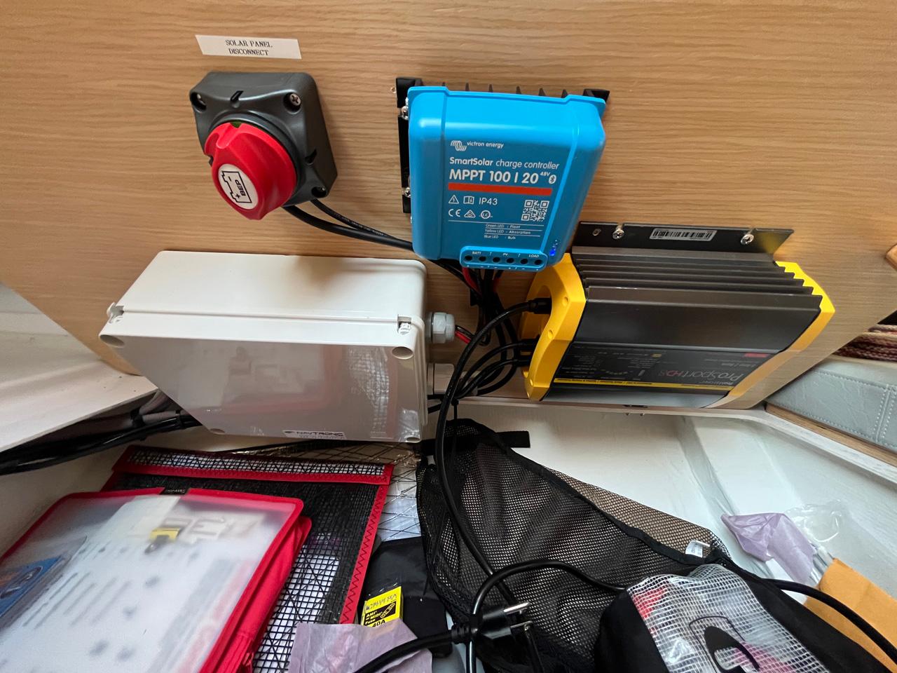 Electrical setup in a 2018 Seascape 27, featuring solar panel disconnect and charge controller.