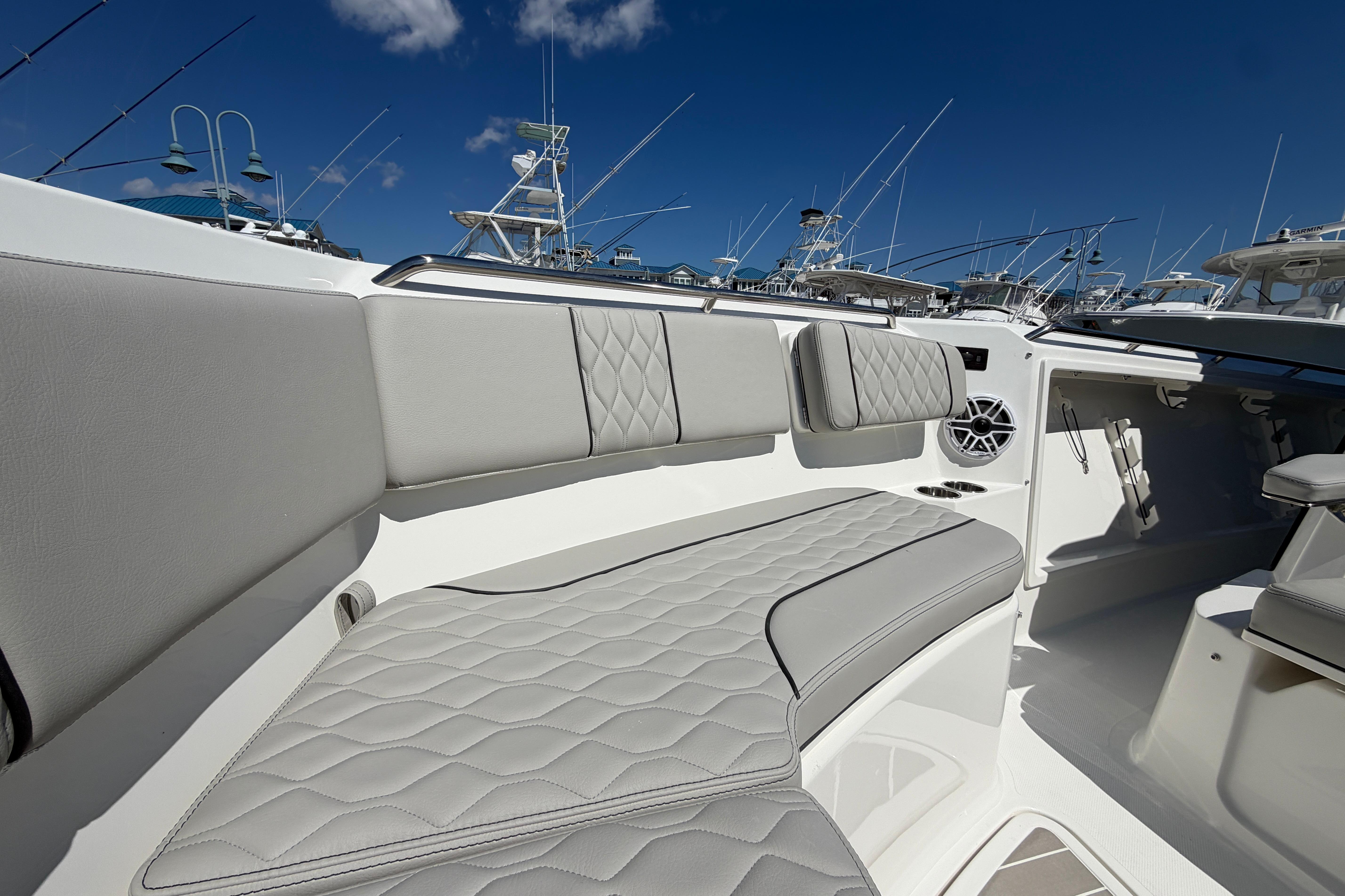 Luxurious seating on the 2026 Pursuit S 358 Sport boat, featuring elegant gray upholstery.