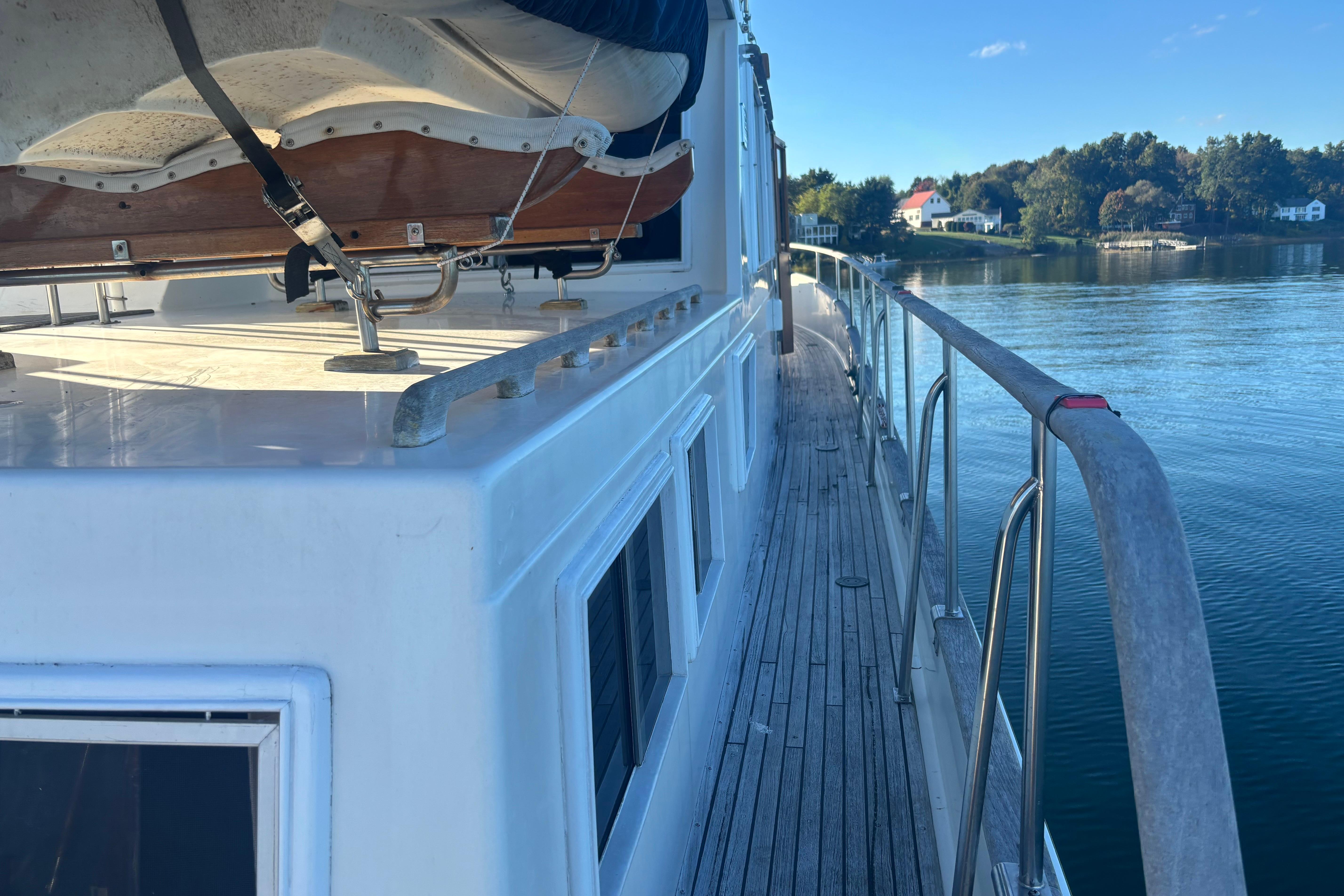 1989 Grand Banks 46 Classic yacht deck with scenic waterfront view.
