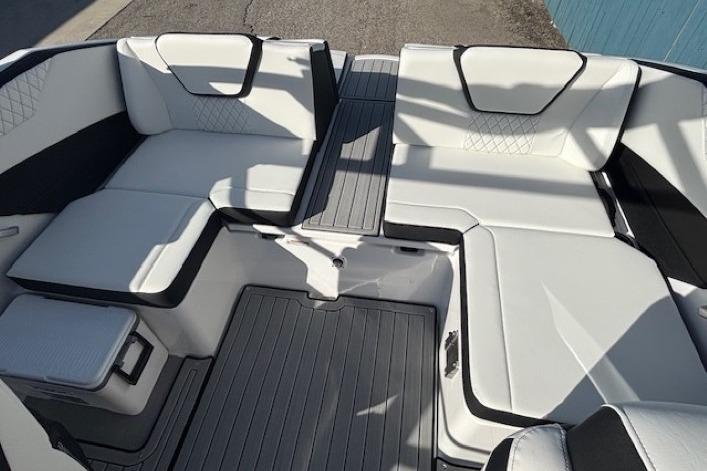 2026 Yamaha Boats 222S interior with white cushioned seating and sleek design.