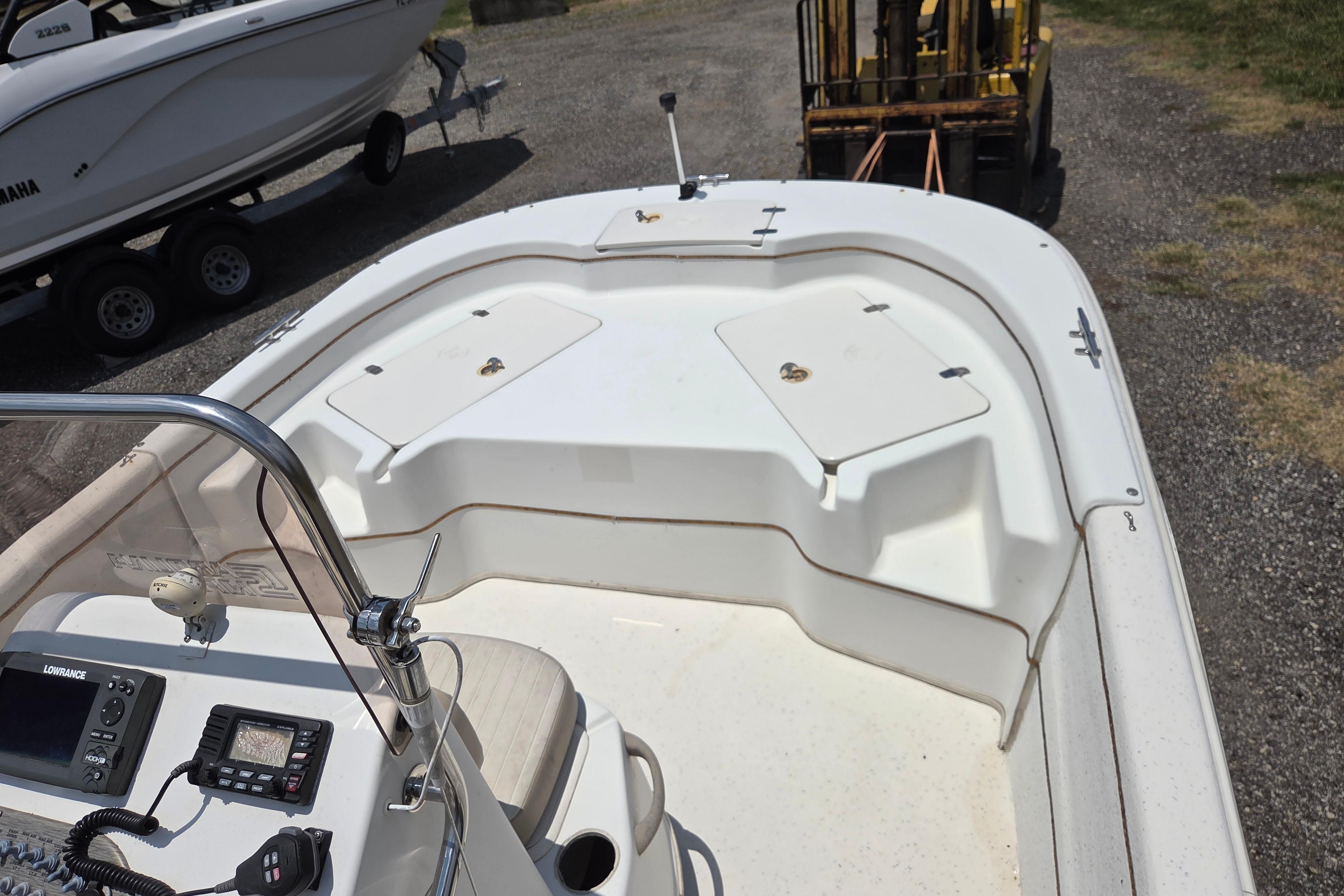 2016 Carolina Skiff 198 DLV boat interior with console and storage compartments.
