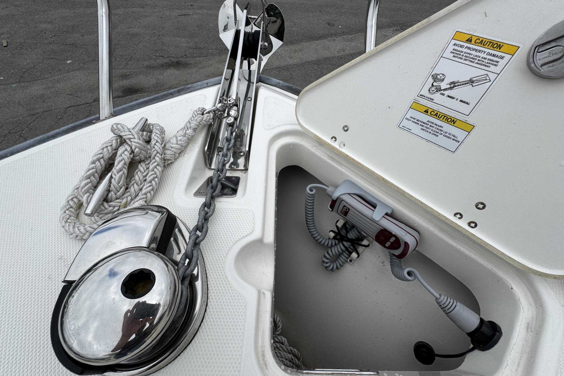 2024 Boston Whaler 230 Outrage anchor system with rope and chain storage.