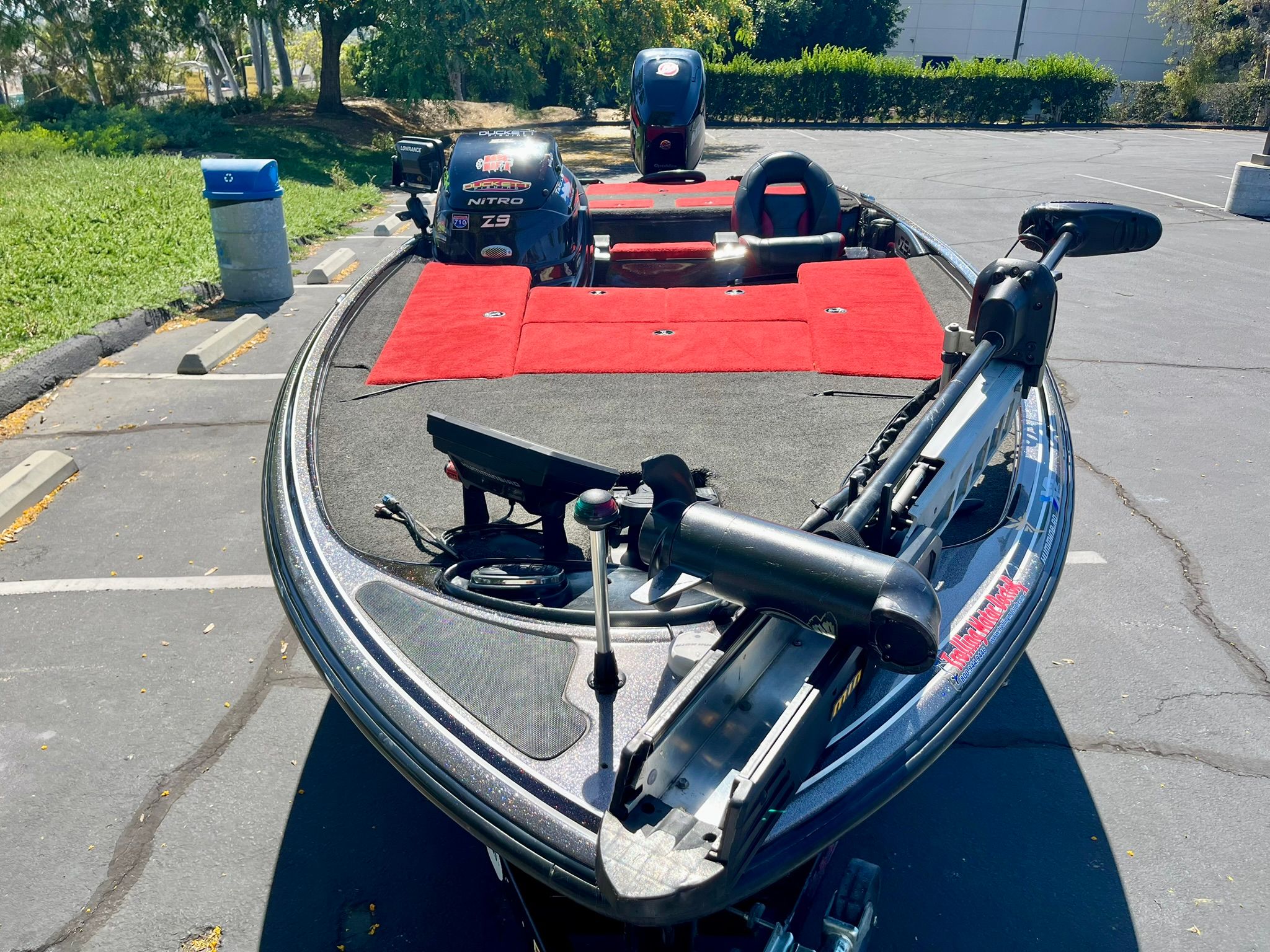 2013 Nitro Z-9 boat on parking lot with red carpet.