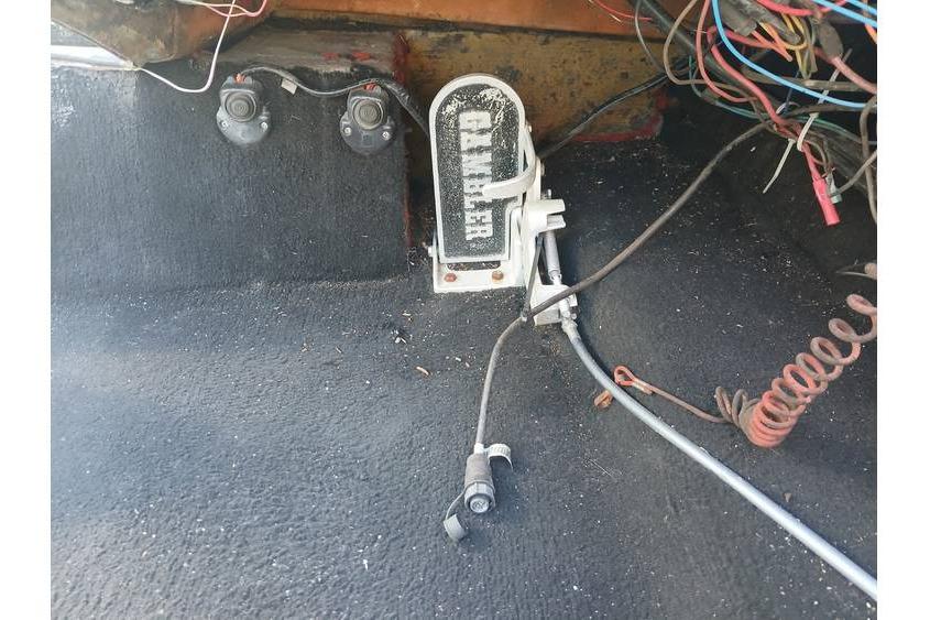 Interior of a 1994 Gambler 21 with wiring and foot pedal.