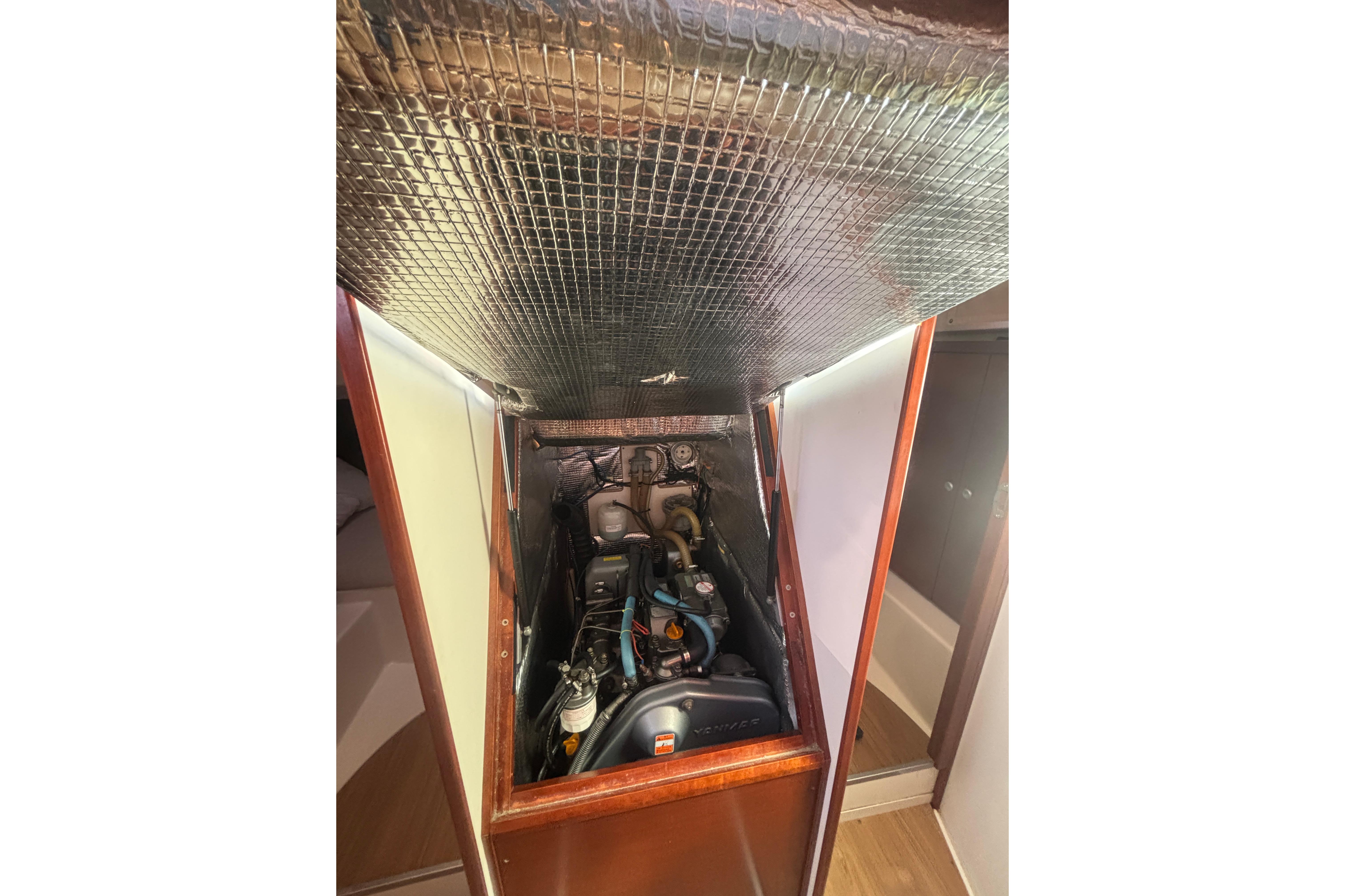 Engine compartment of a 2008 Hanse 370 sailboat, showcasing insulation and mechanical components.