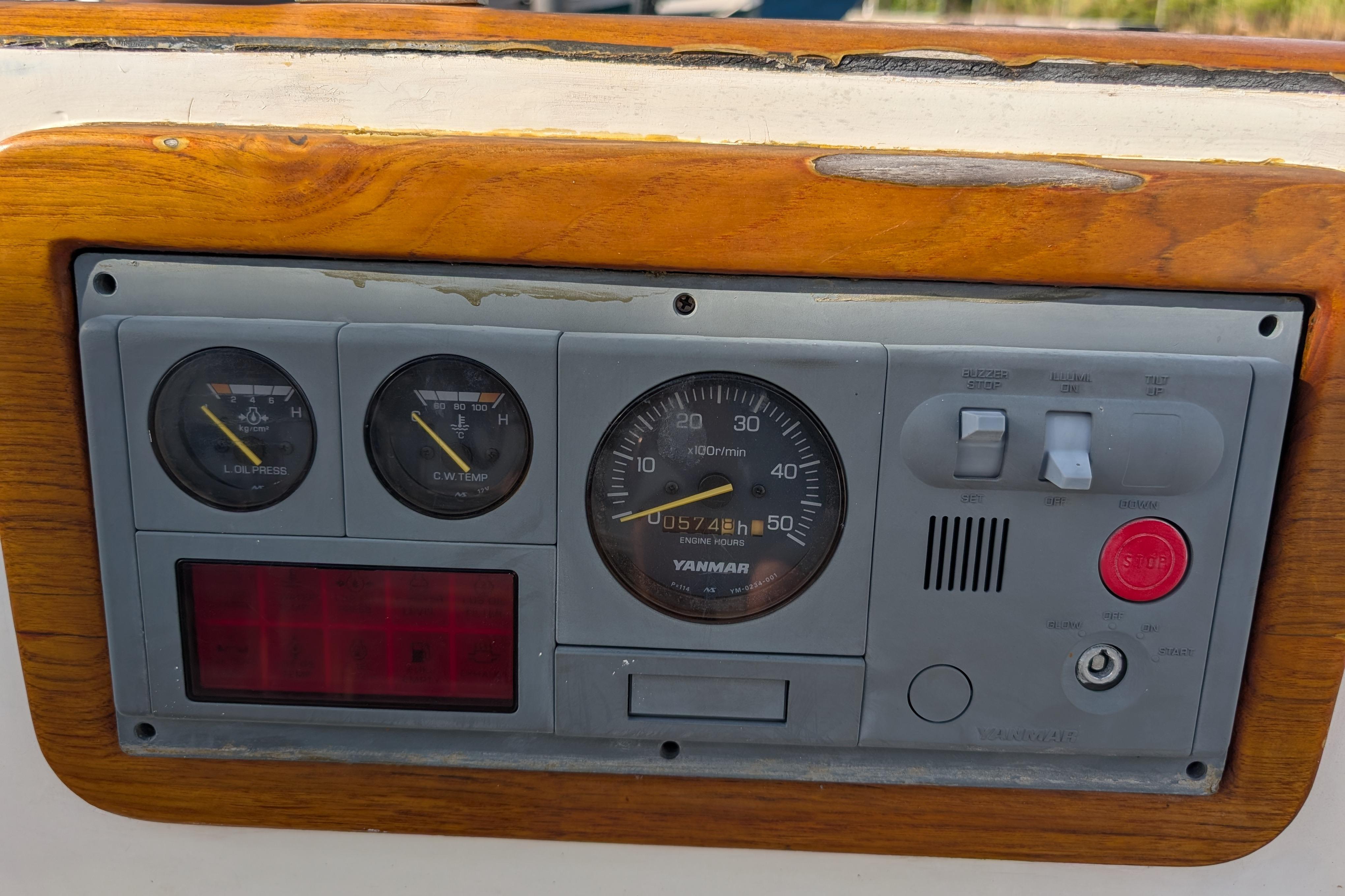 Control panel of a 1983 Robert Perry 41 sailboat with Yanmar engine gauges.