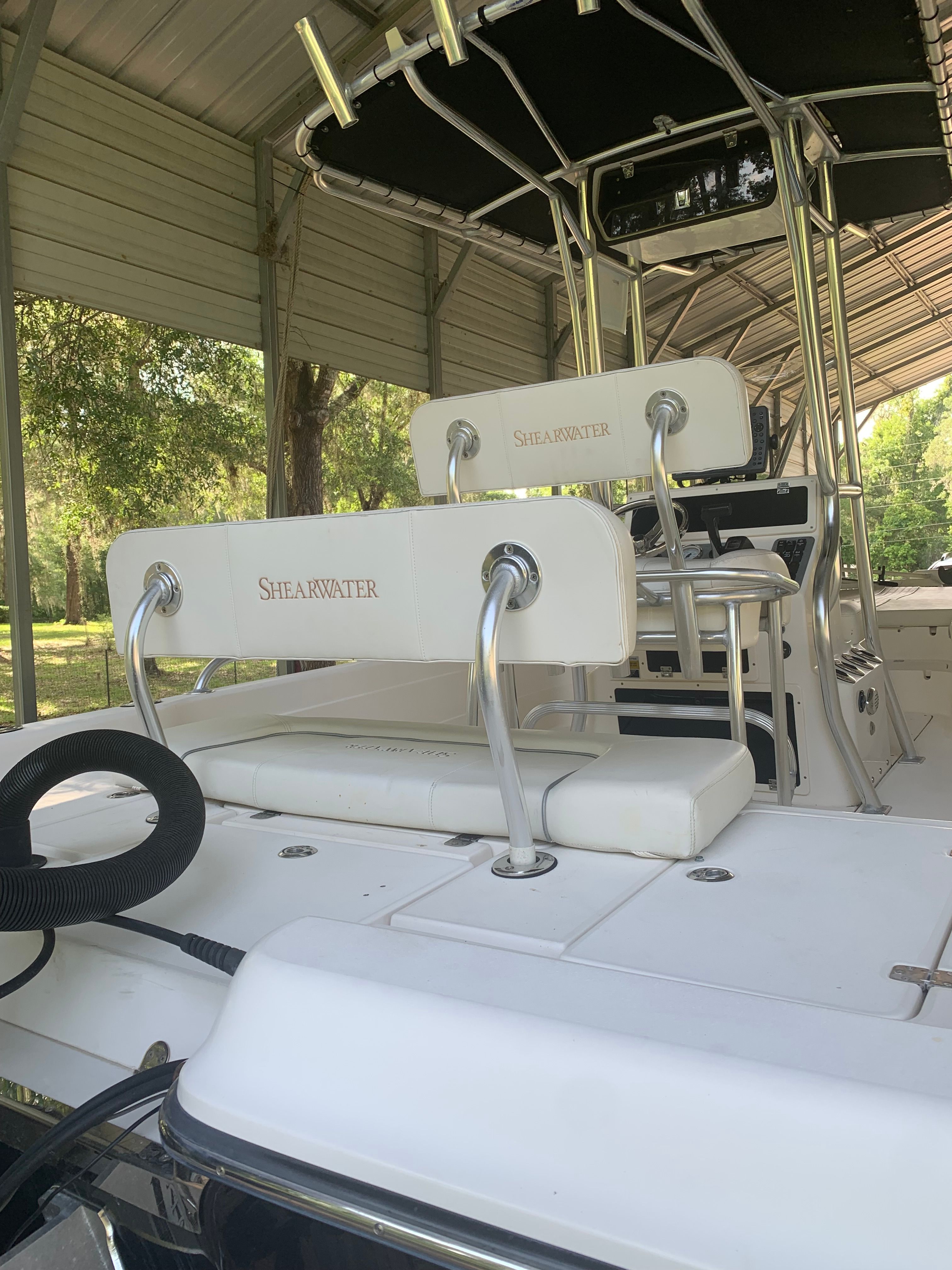 2007 ShearWater 23 LTZ boat with outdoor seating.