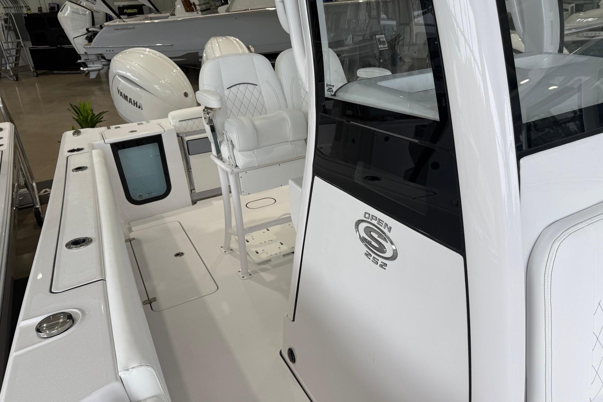 2026 Sportsman Open 252 Center Console boat interior with seating and console details.