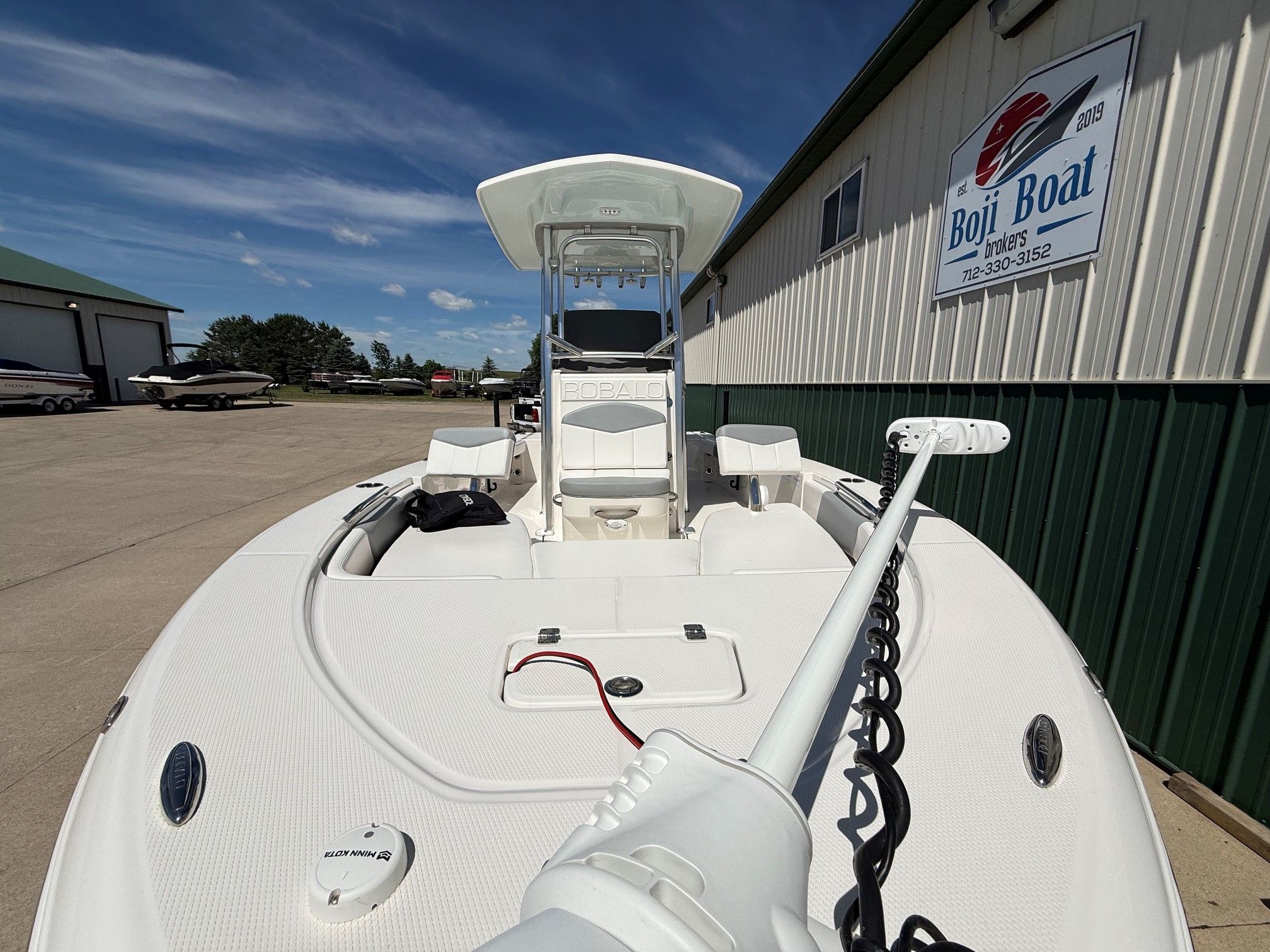2021 Robalo 226 Cayman boat on a parking lot.