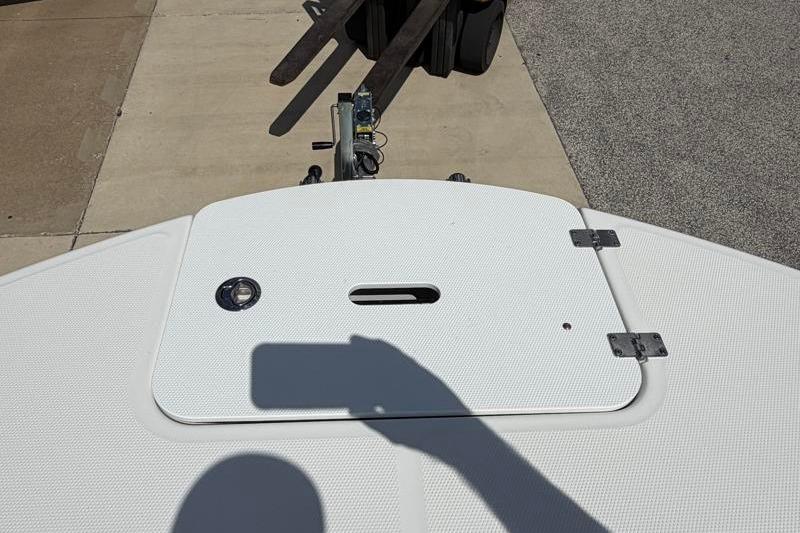 2026 Hurricane SunDeck Sport 2050 OB boat deck with hatch and shadow.