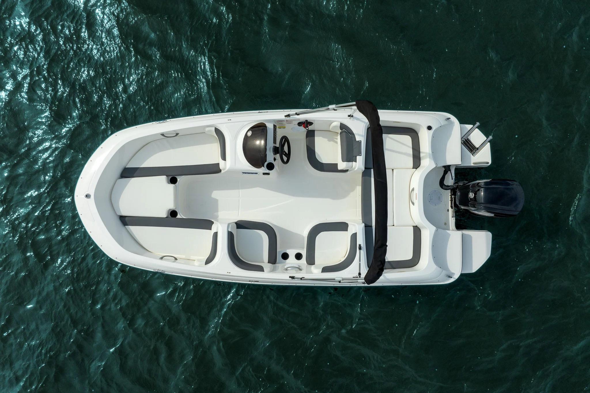 Manufacturer Provided Image: 2025 Bayliner Element E16 boat on water, aerial view, sleek design, spacious seating.