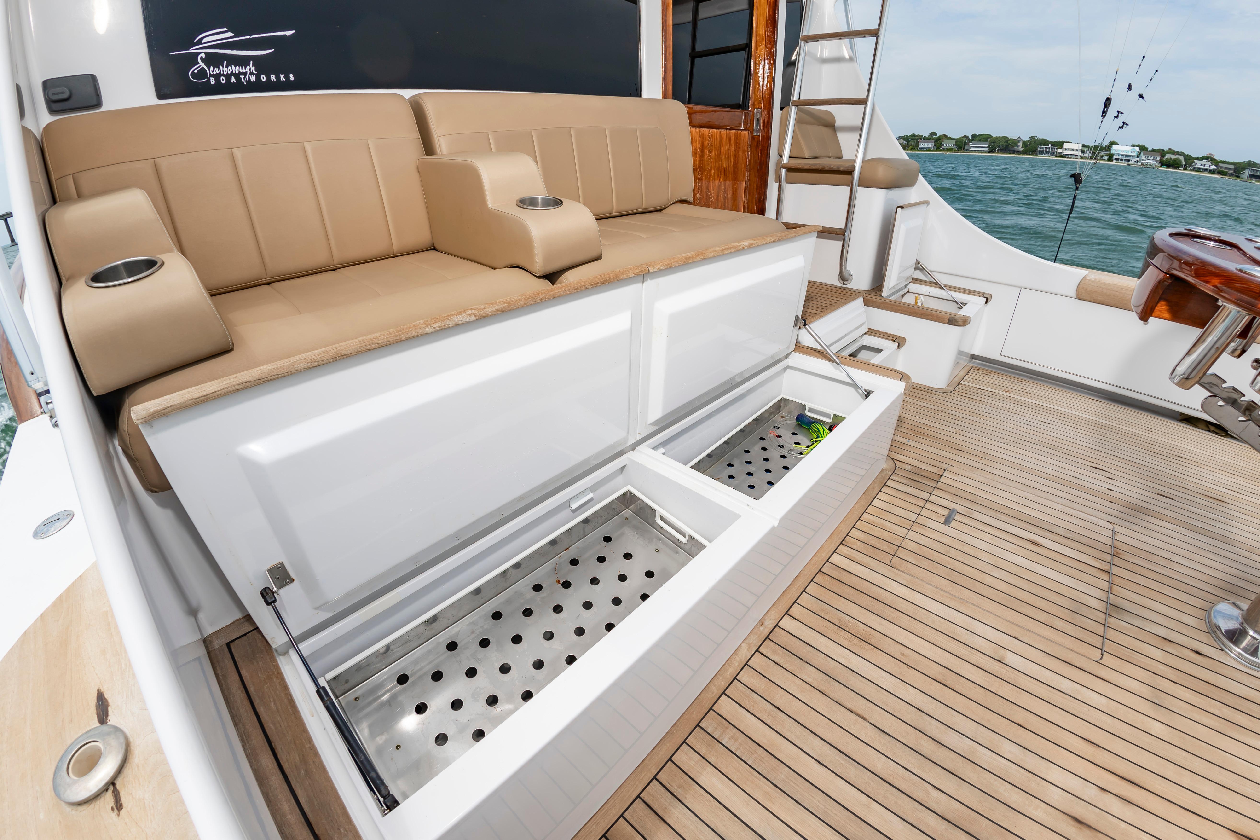 Luxury seating and storage on 1993 Custom Carolina Scarborough 56 Convertible yacht deck.
