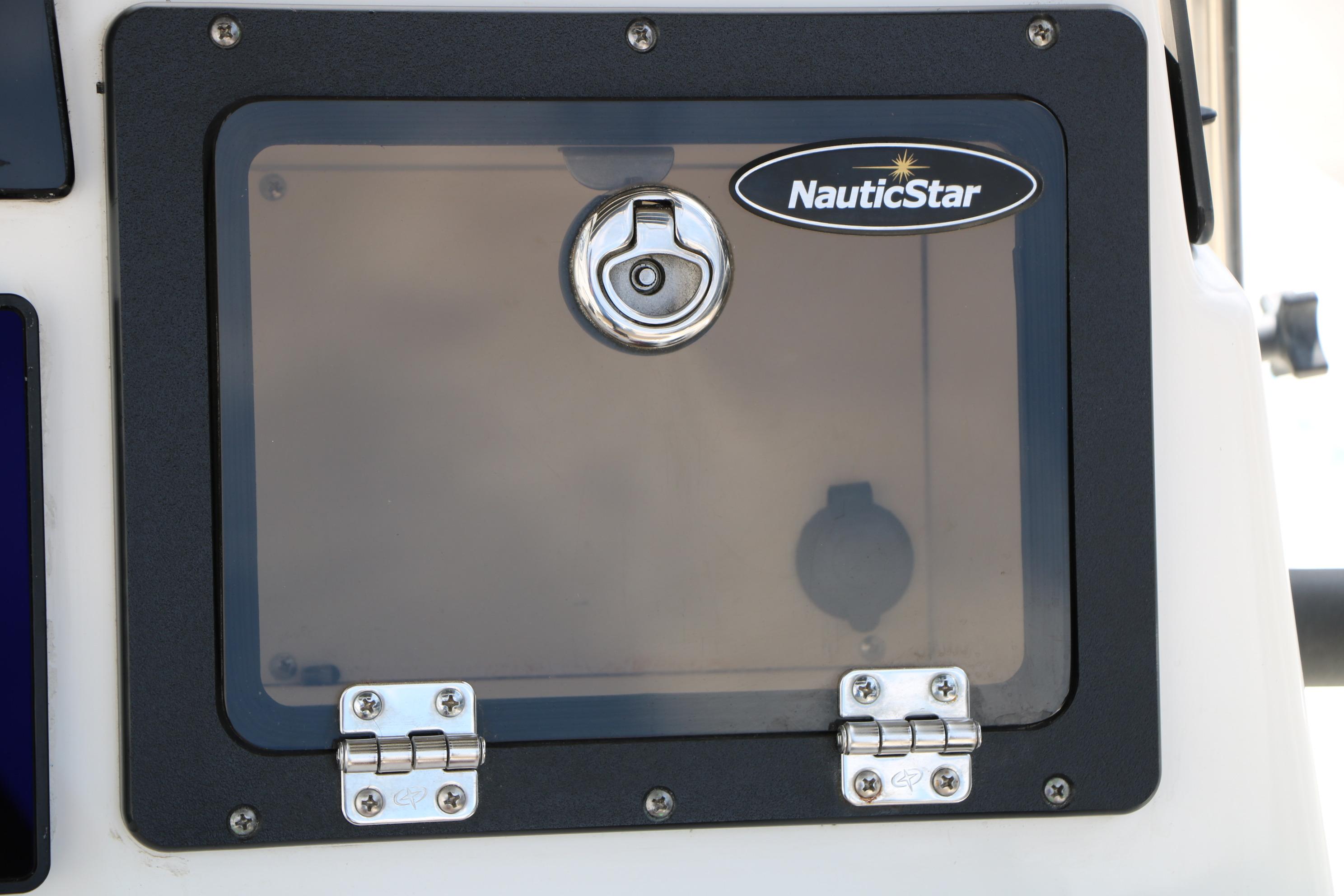NauticStar 2140 Sport 2020 boat compartment with lock and logo.