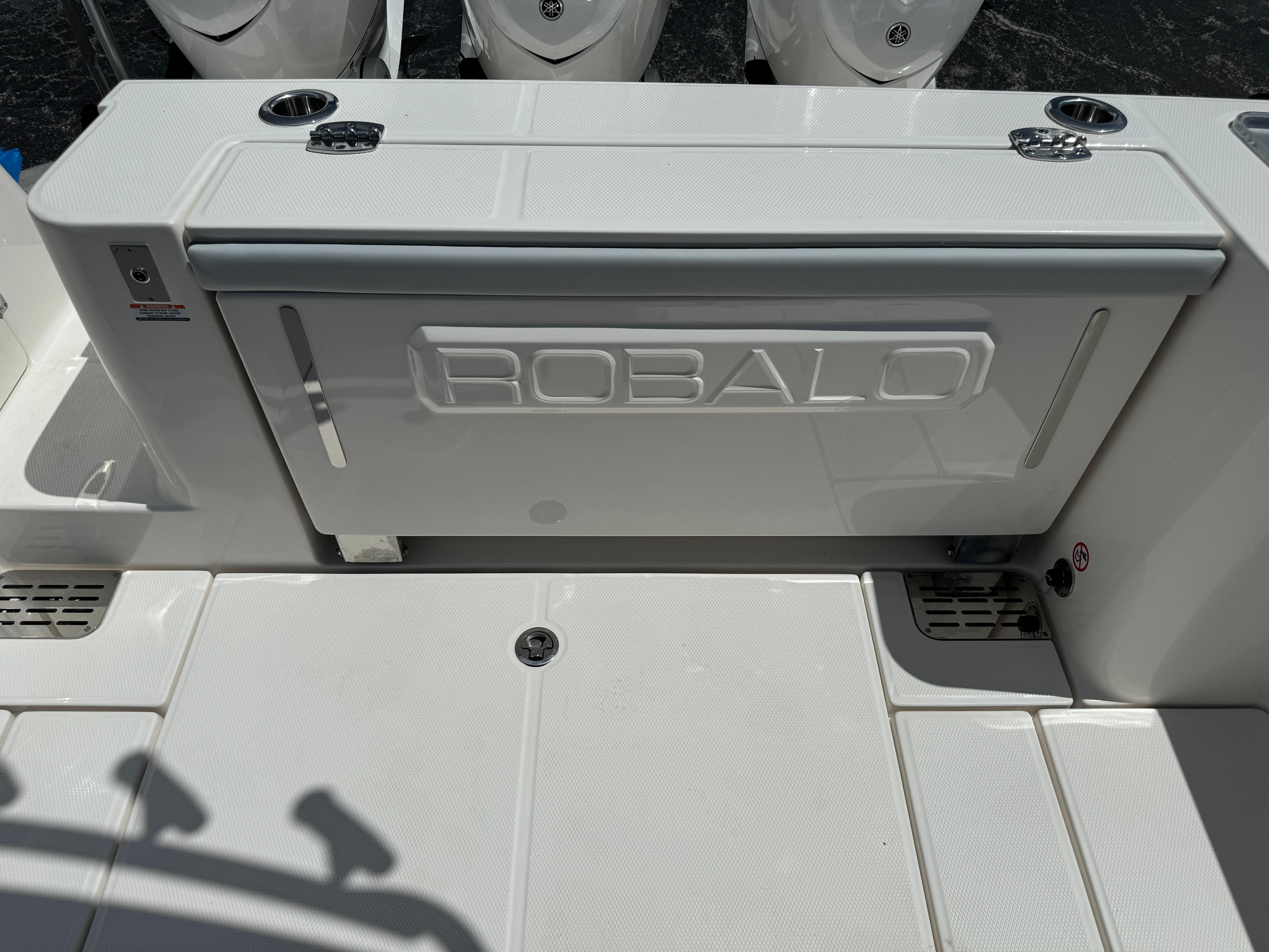 2025 Robalo R360 Center Console boat deck with storage compartment.