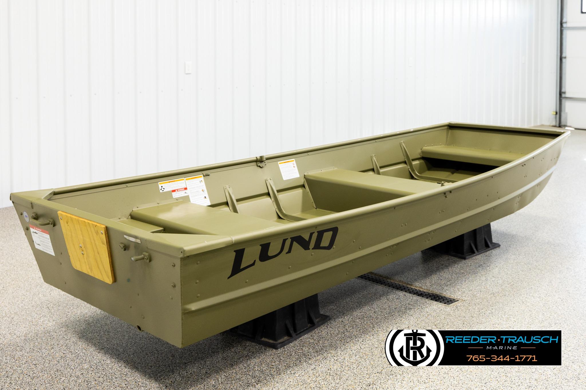 2025 Lund 1240 boat displayed indoors on stands.