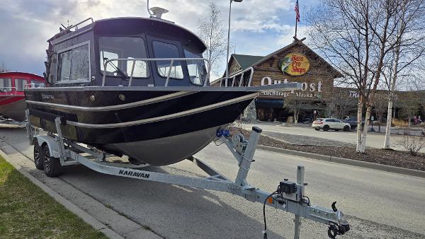 2024 Spartan 220 Maximus boat on trailer outside Bass Pro Shops, Anchorage, Alaska.