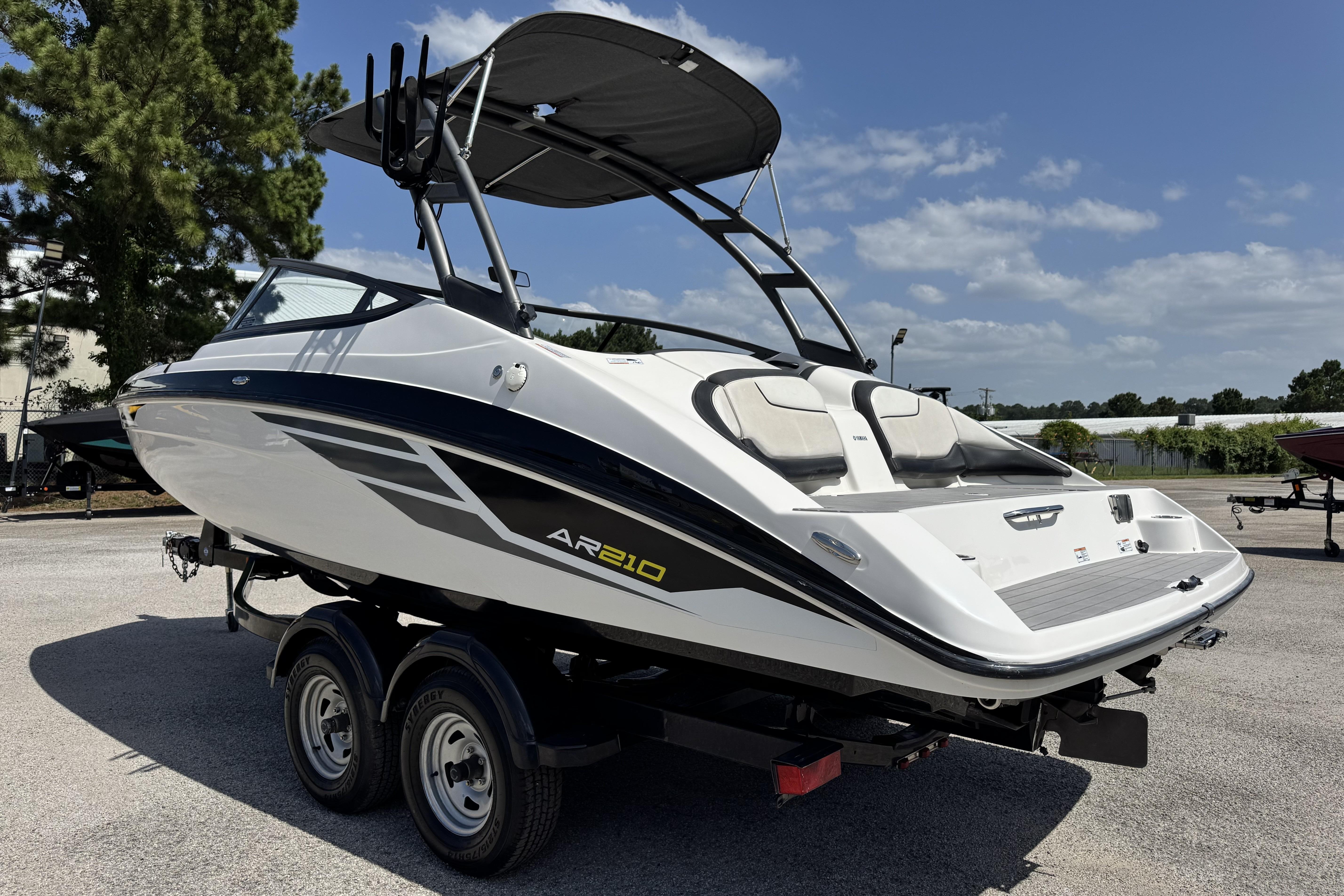 2018 Yamaha Boats AR210 on trailer, sleek design, sunny day, outdoor setting.