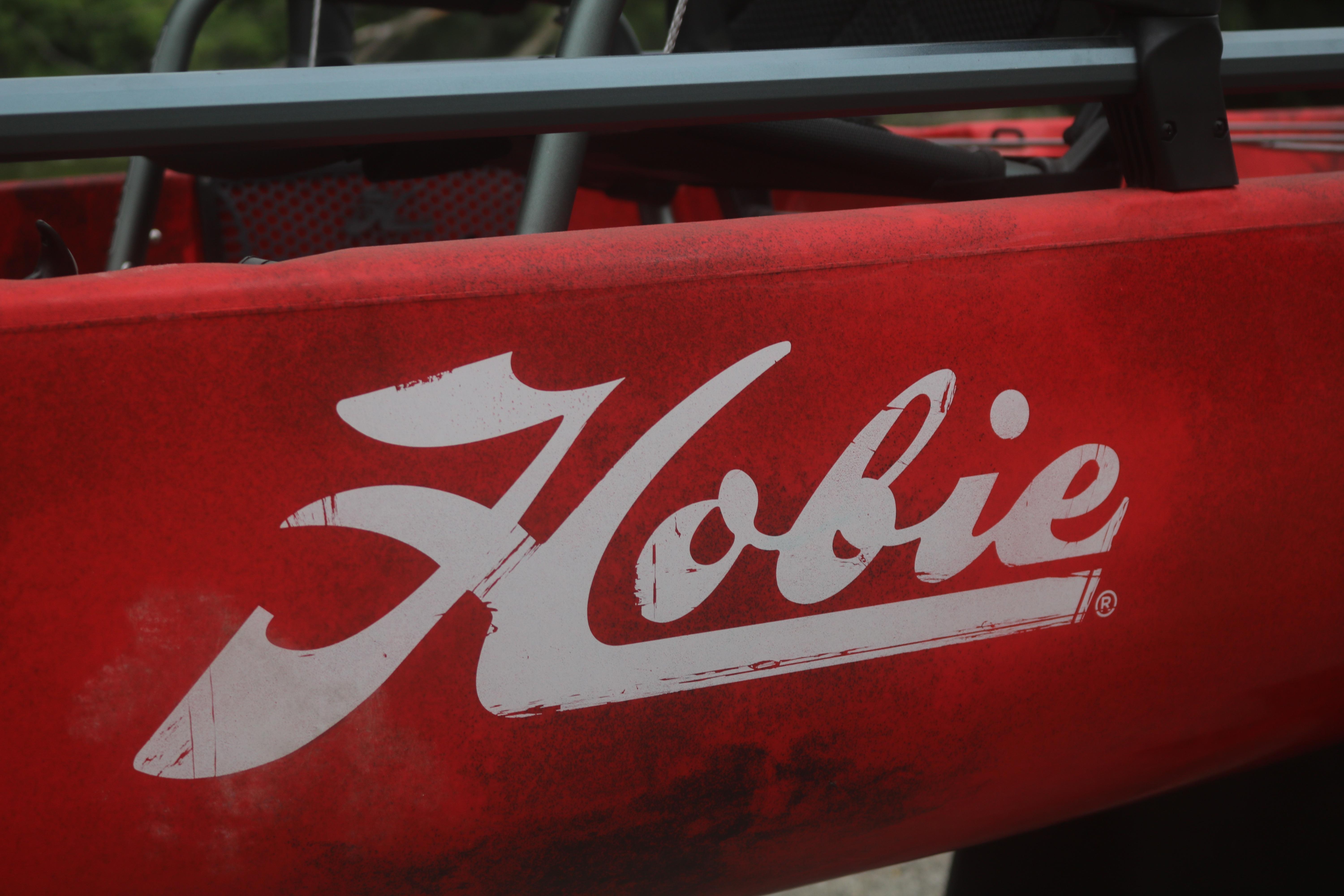 Red Hobie Mirage Pro Angler 14 kayak, 2023 model, featuring bold white logo.