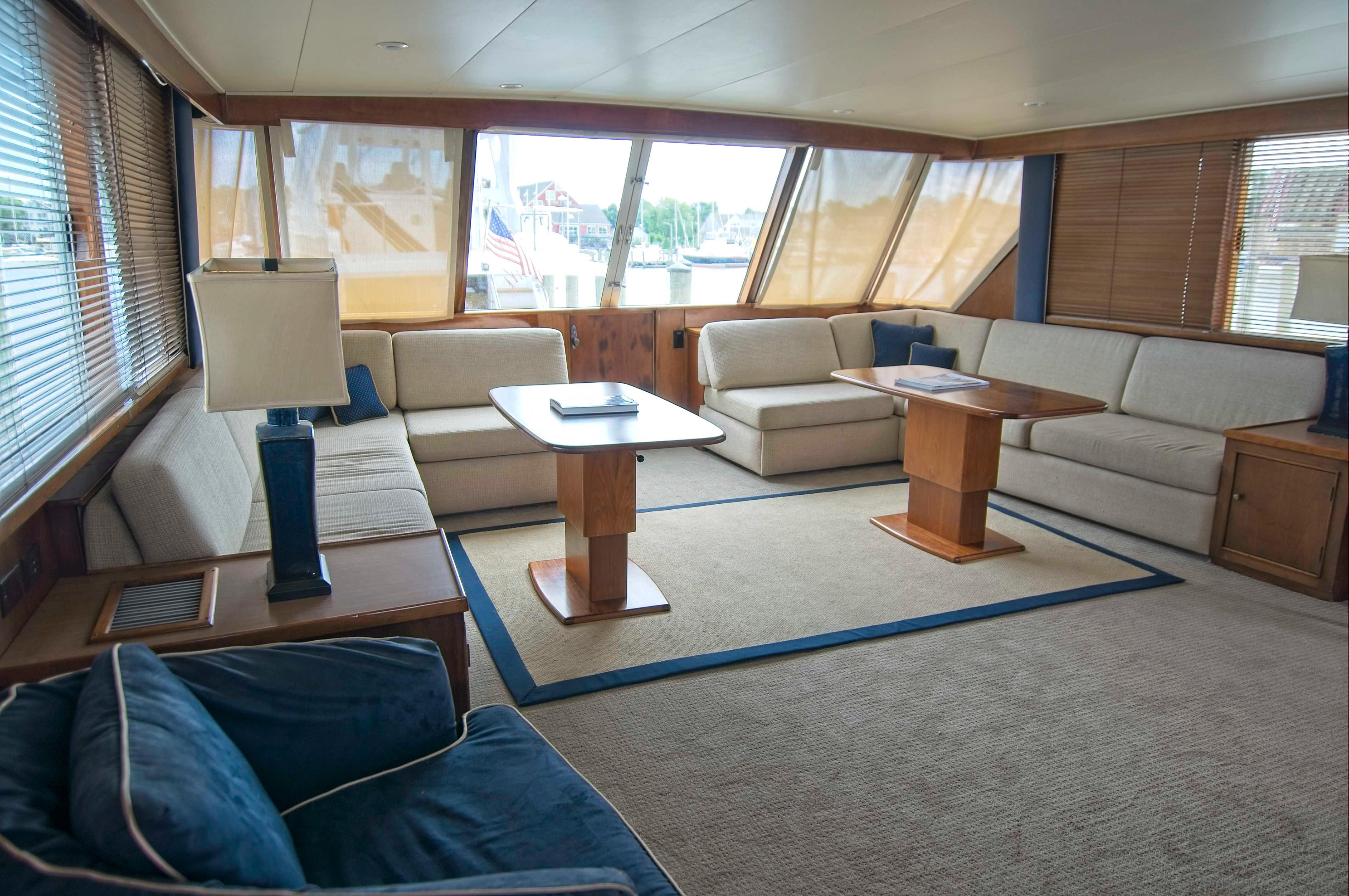 Luxurious 1982 Burger Flybridge yacht interior with spacious seating and elegant decor.