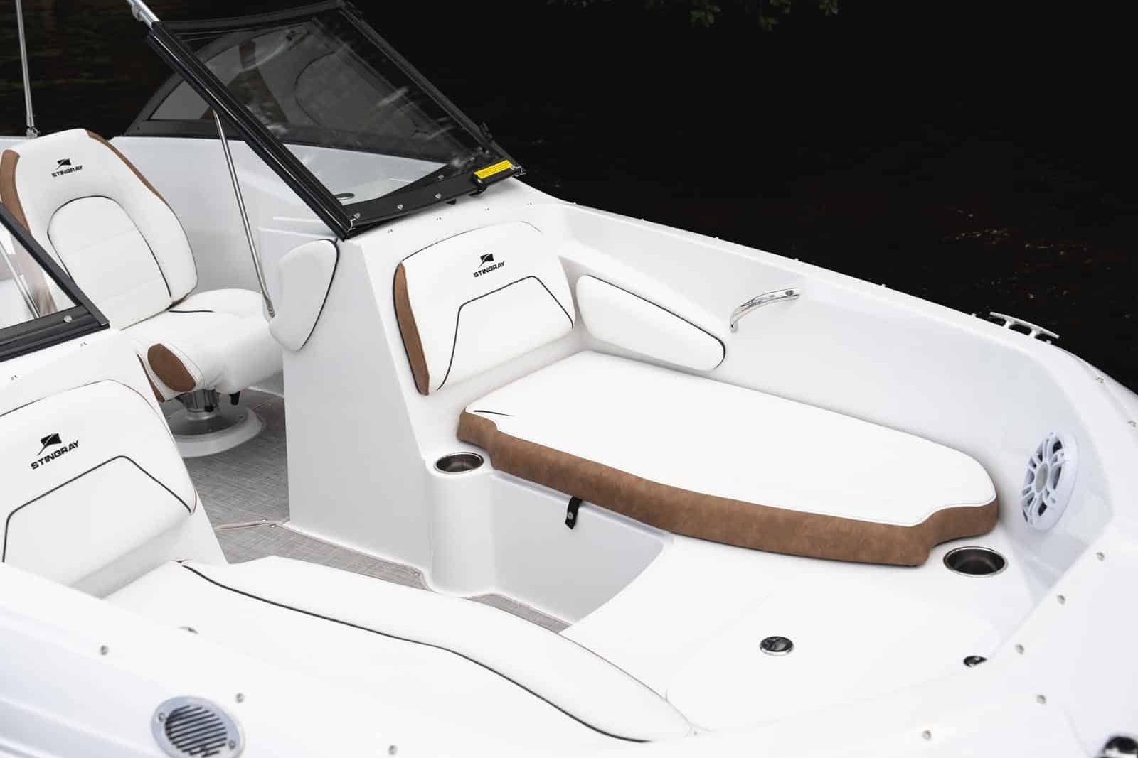 Manufacturer Provided Image: 2026 Stingray 191 DC boat interior with white and brown seating, cup holders, and speaker.