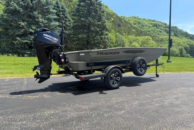 2026 Tracker Grizzly 1650 T Prairie Wings Edition boat on trailer, outdoors.