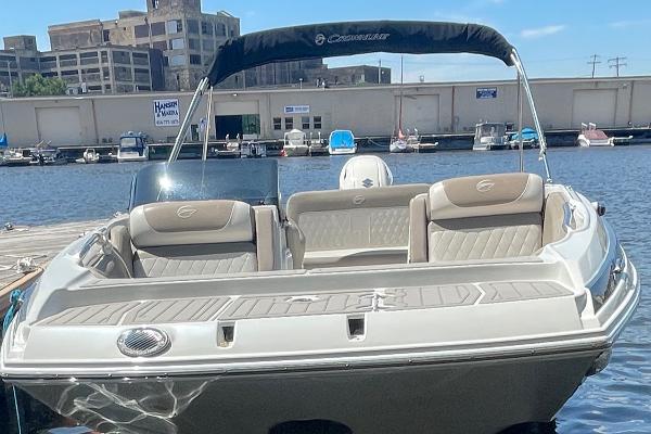 2020 Crownline E 205 XS boat docked at marina, sunny day.
