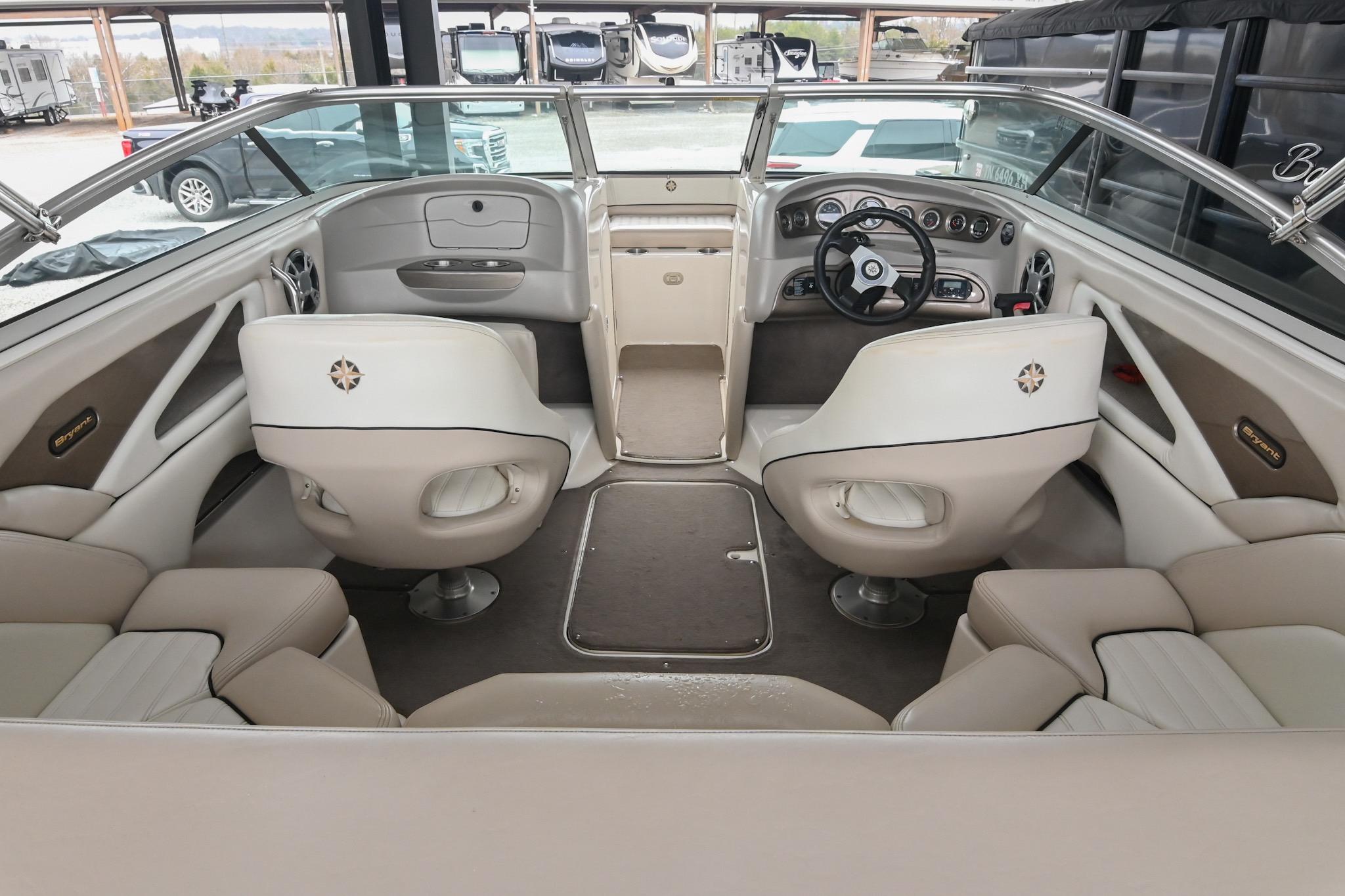 2007 Bryant 270 boat interior with beige seating and modern dashboard controls.