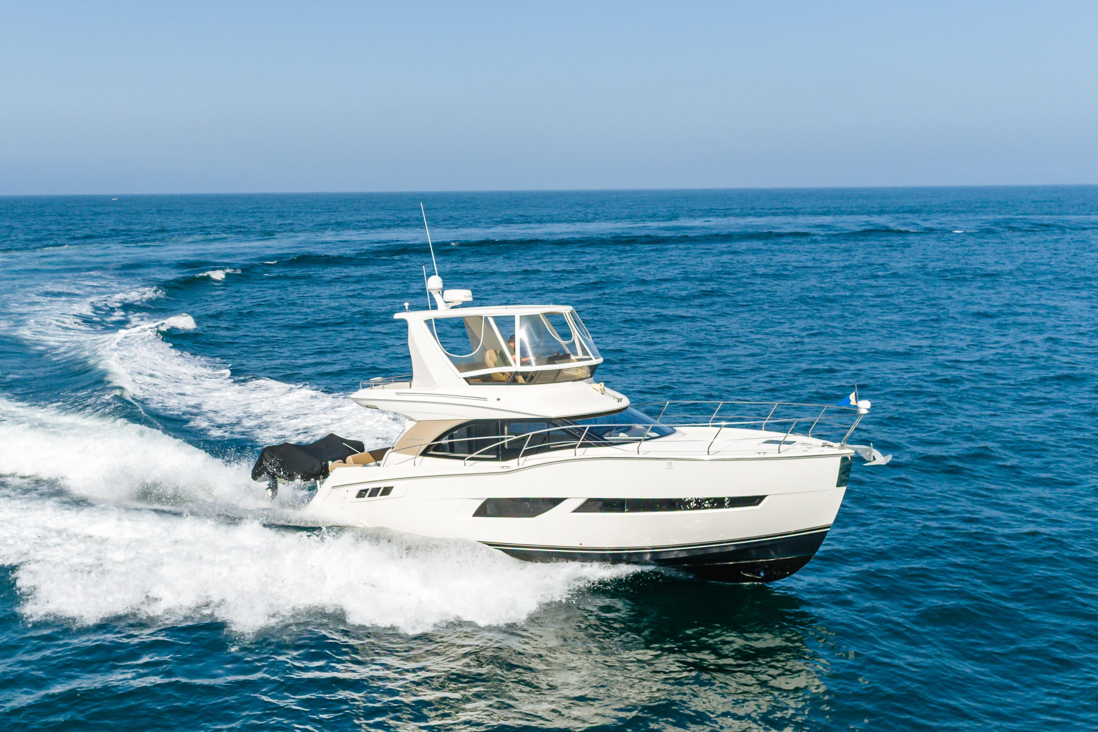 2018 Carver C40 yacht cruising on open ocean waters.
