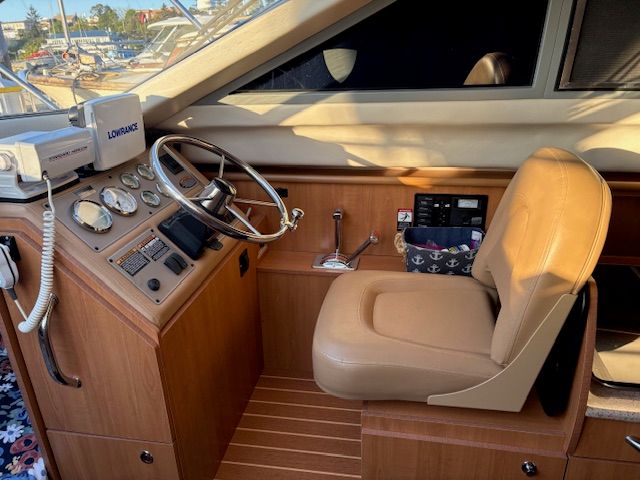 Interior of a 2008 Bayliner Discovery boat with helm console.