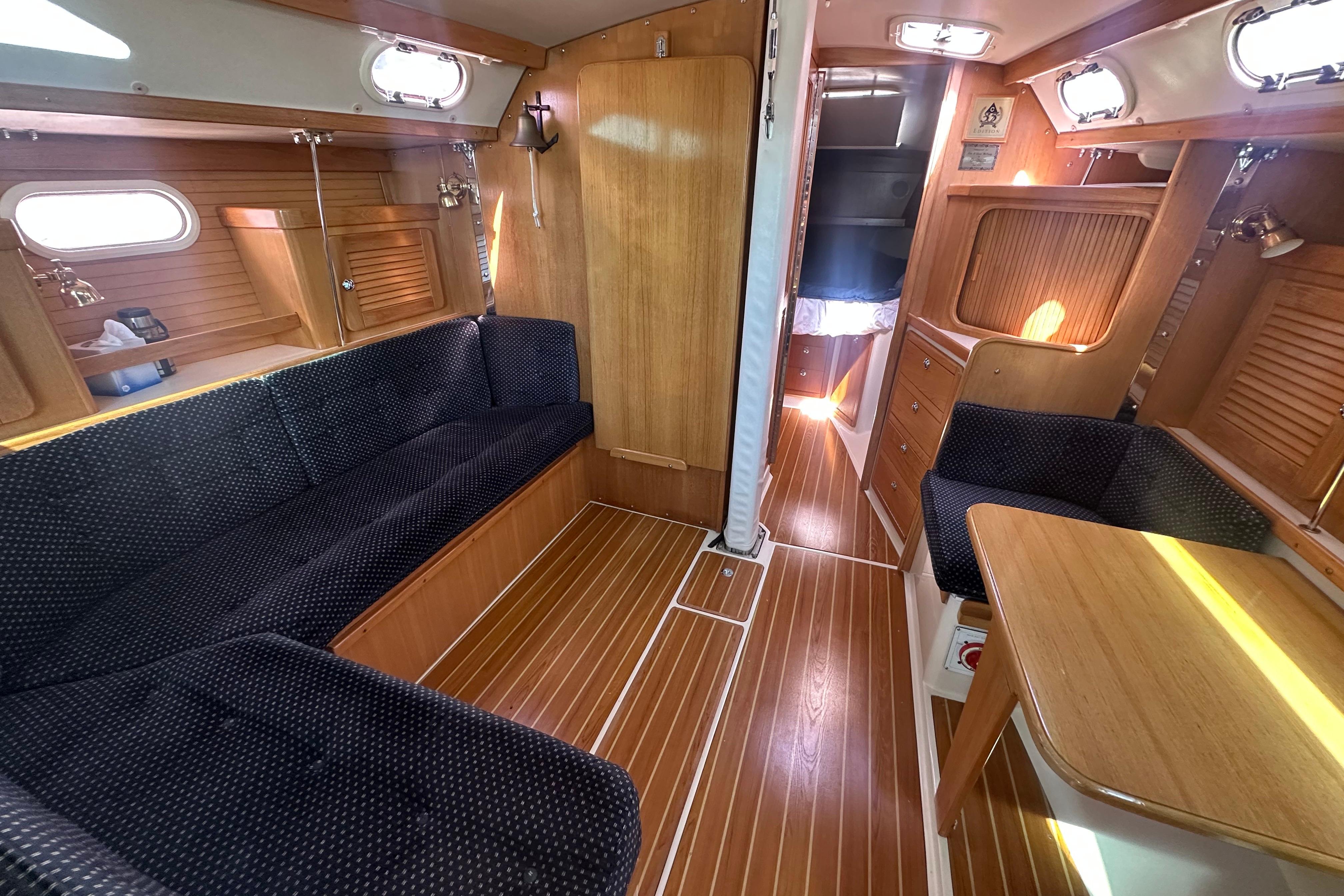 Interior of a 2005 Catalina 36 MkII sailboat with wood finish and seating area.
