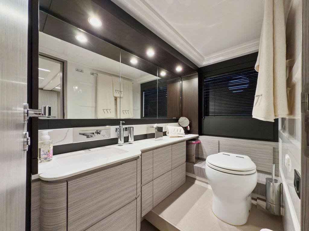 Luxurious bathroom interior of 2020 Azimut 66 yacht with modern fixtures and elegant design.