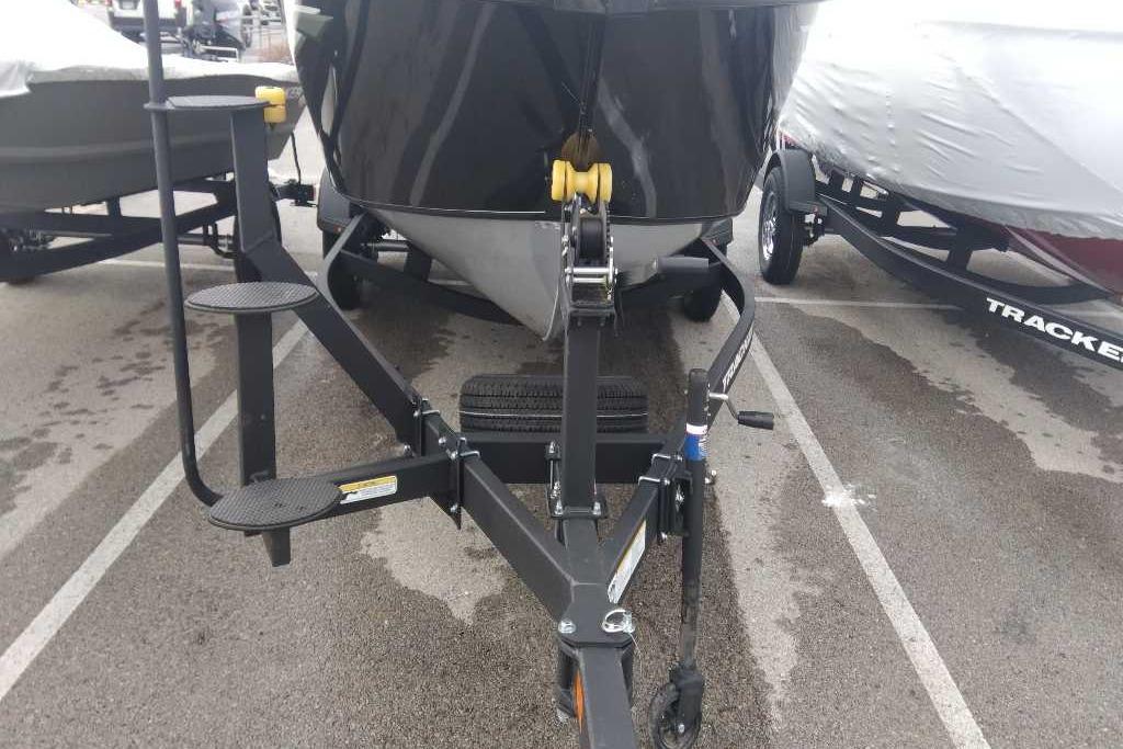 2026 Tracker Targa V-18 Combo boat on trailer, front view in parking lot.