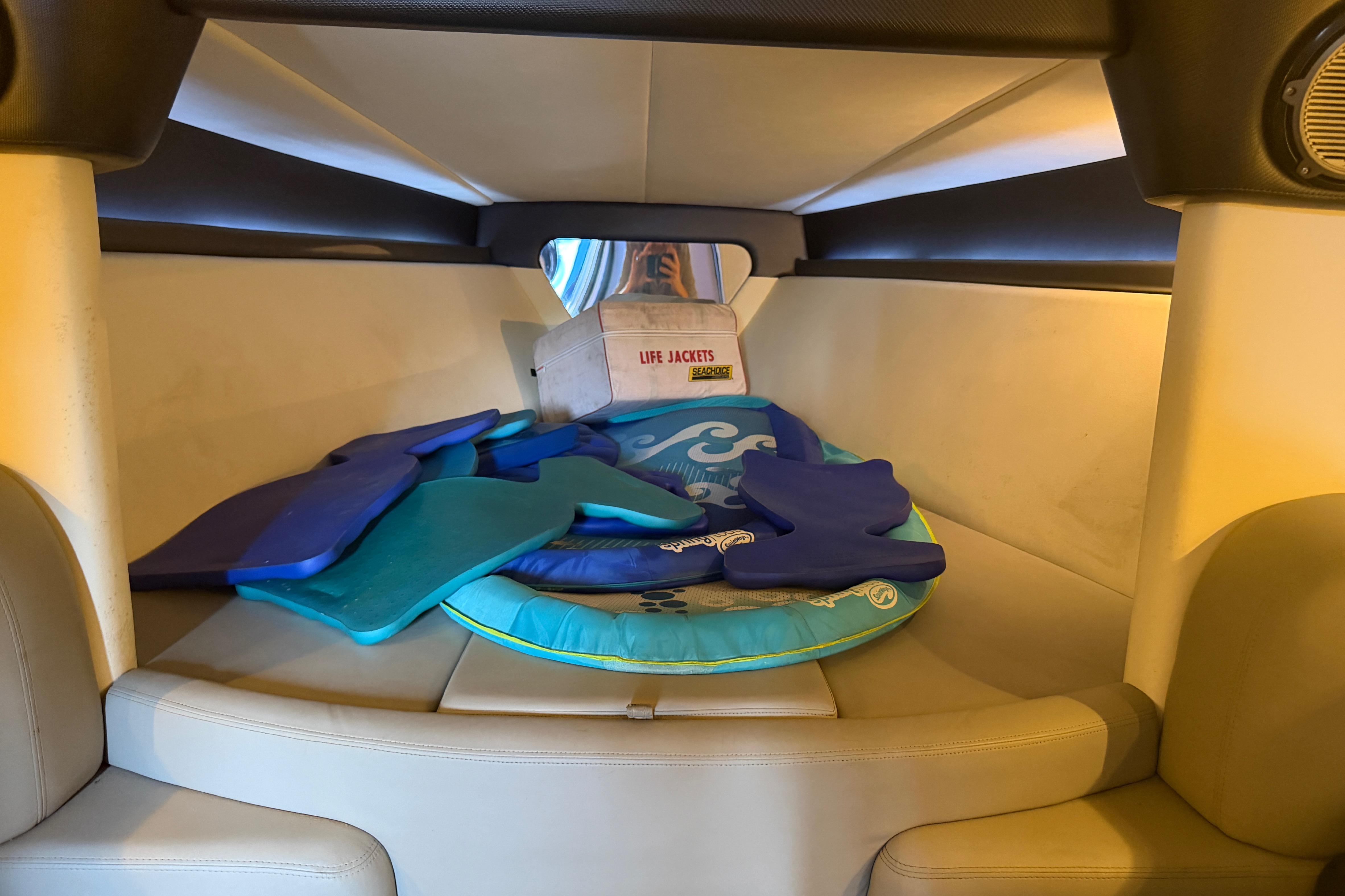 Interior cabin of 2013 Nor-Tech 477 SPX Vee Bottom with life jackets and cushions.