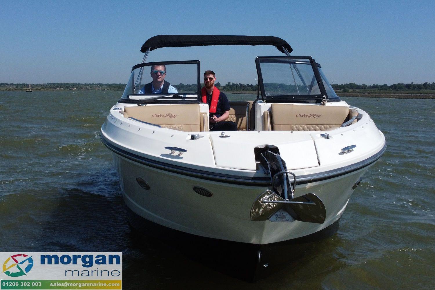 2020 Sea Ray 250 SLX boat on water, featuring two passengers, clear sky, and Morgan Marine branding.