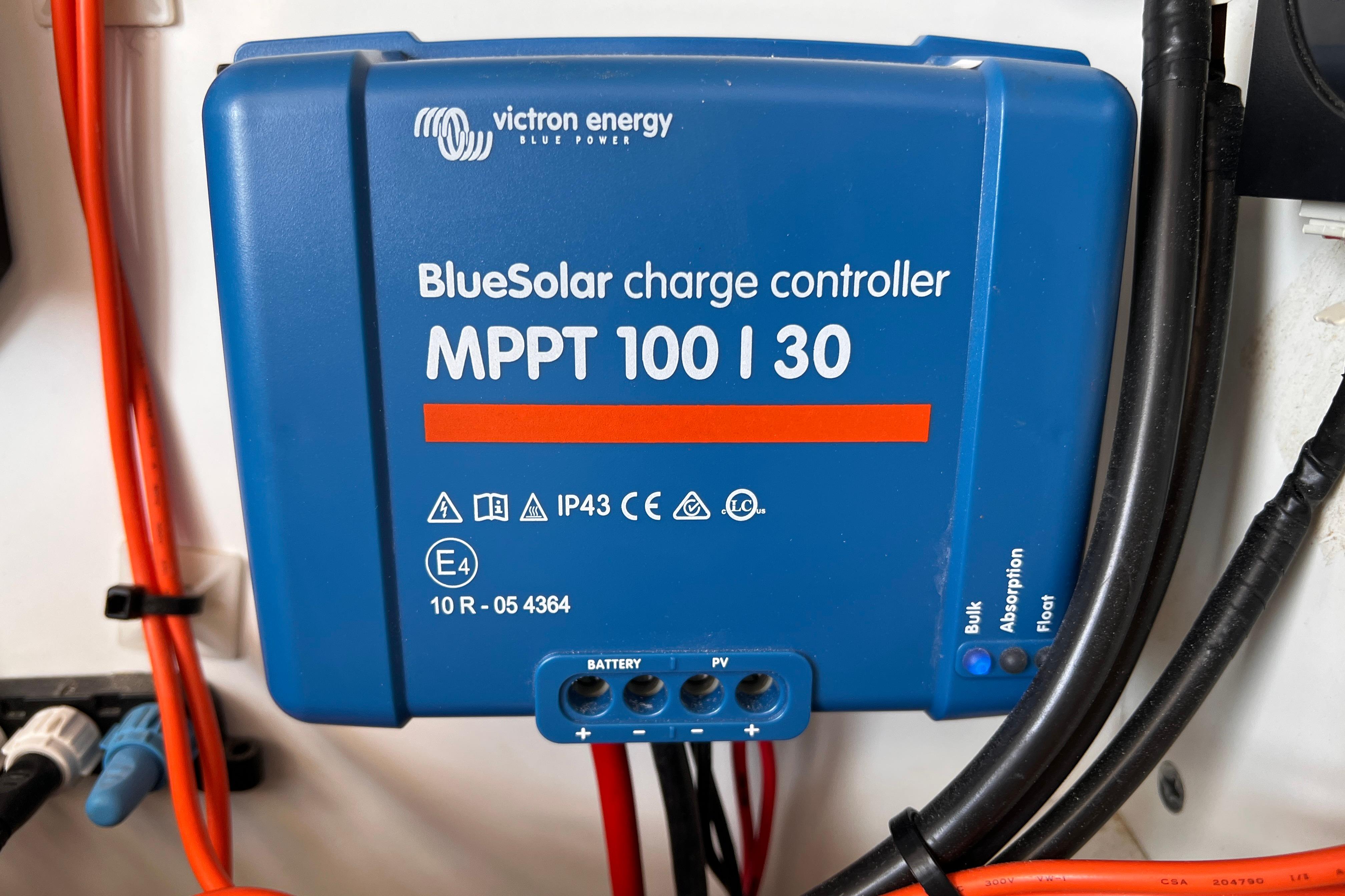 BlueSolar charge controller MPPT 100/30 by Victron Energy, installed with cables.